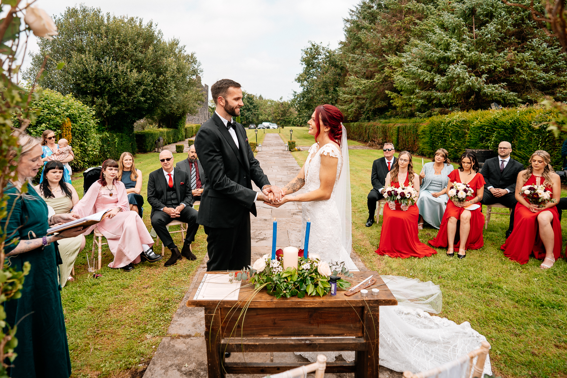 Outdoor wedding ceremony in the gardens of Cloghan Castle