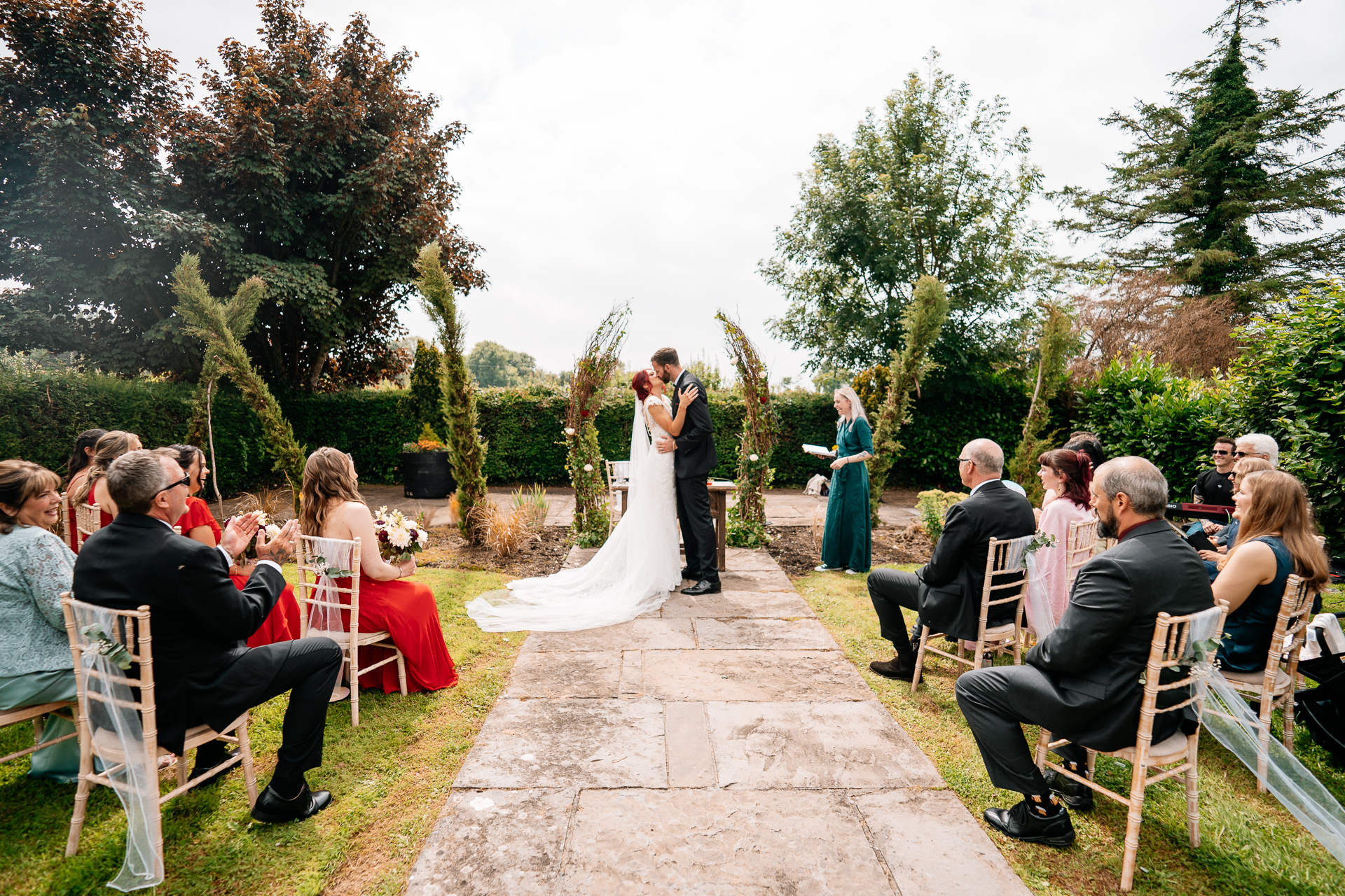Outdoor wedding ceremony in the gardens of Cloghan Castle