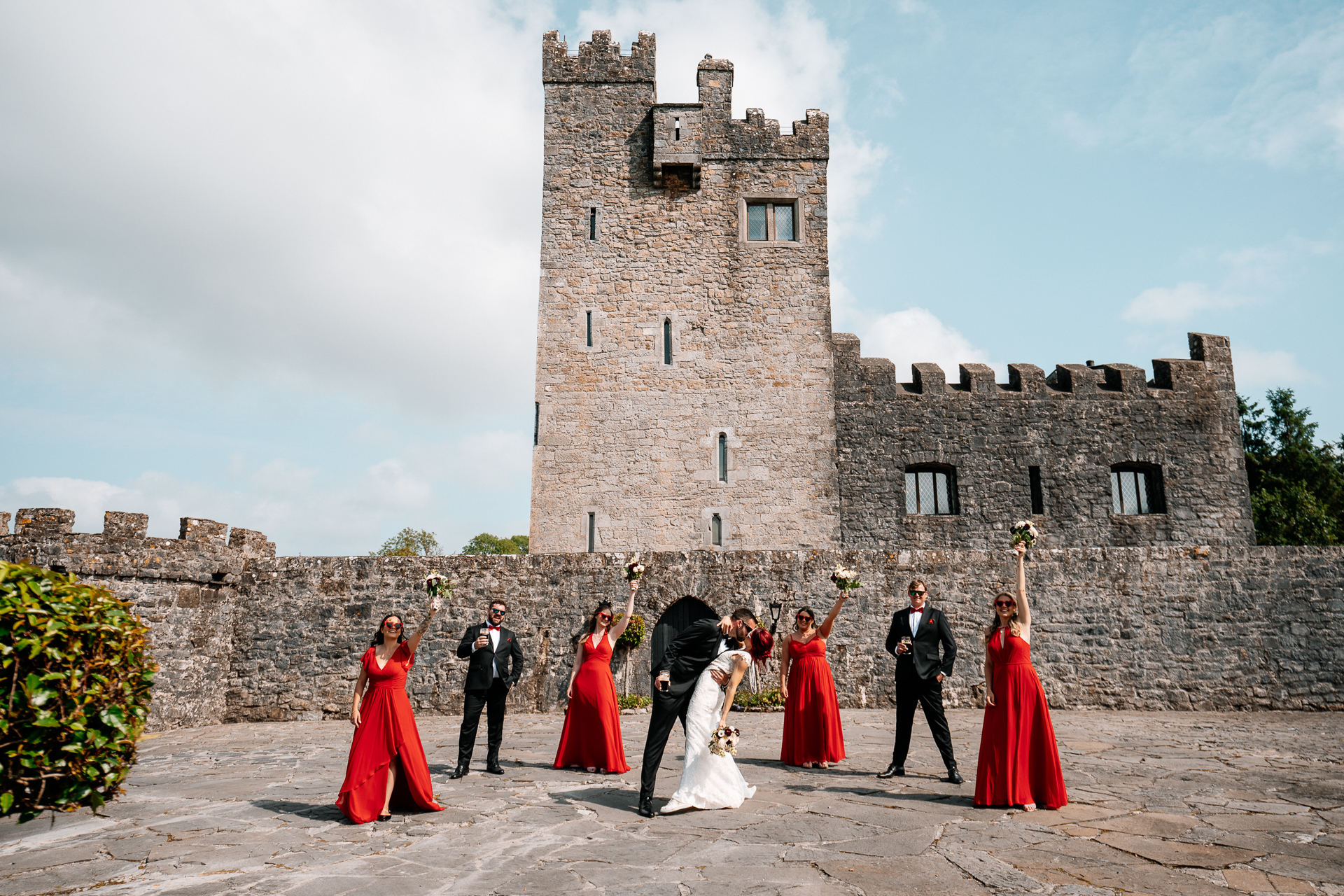 Bridal party portraits in front of Cloghan Castle during destination wedding