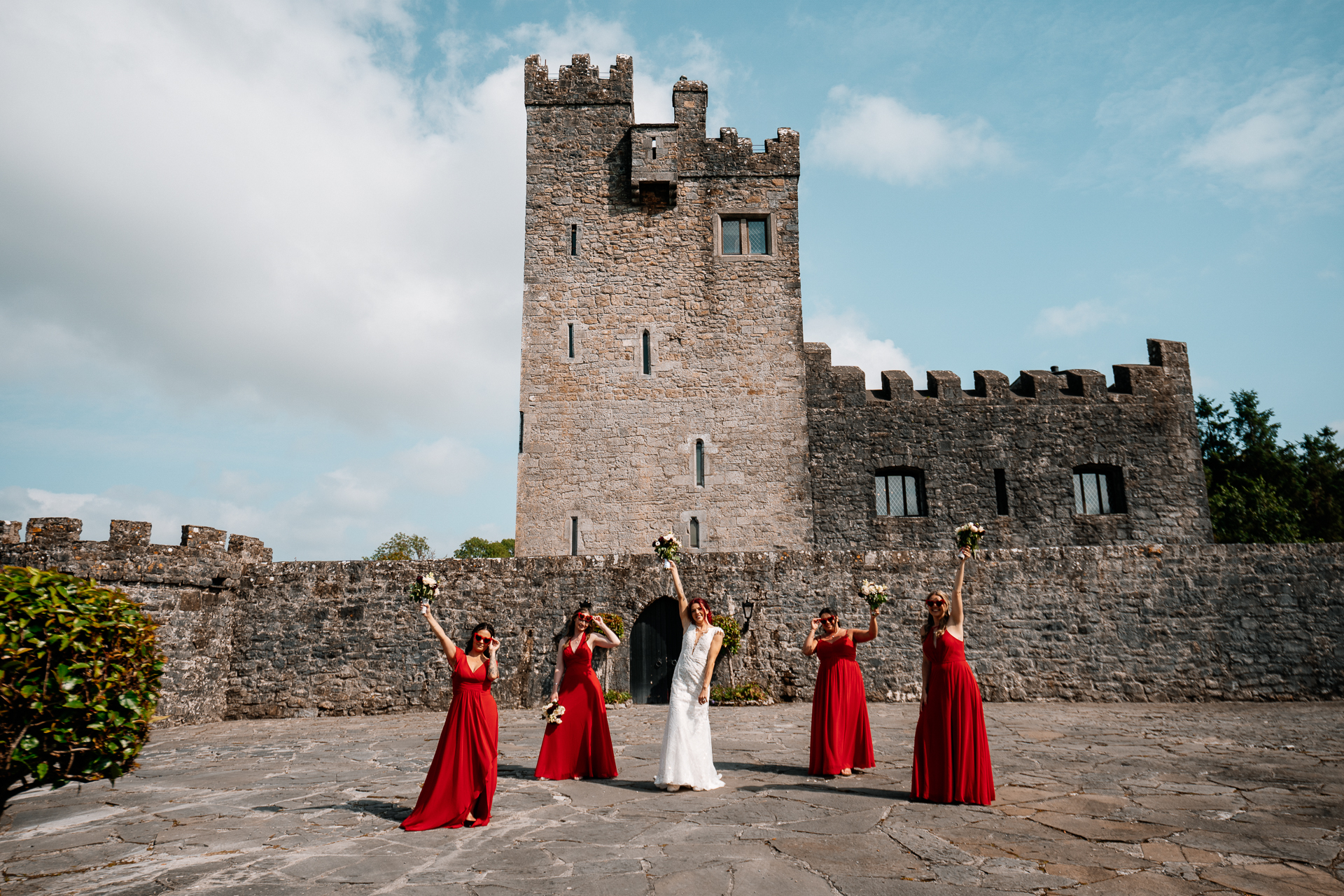 Bridal party portraits in front of Cloghan Castle during destination wedding