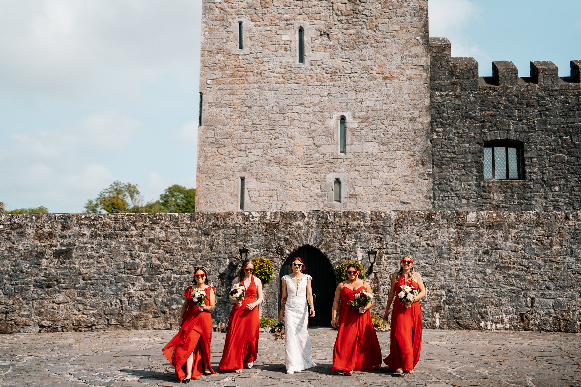 Bridal party portraits in front of Cloghan Castle during destination wedding