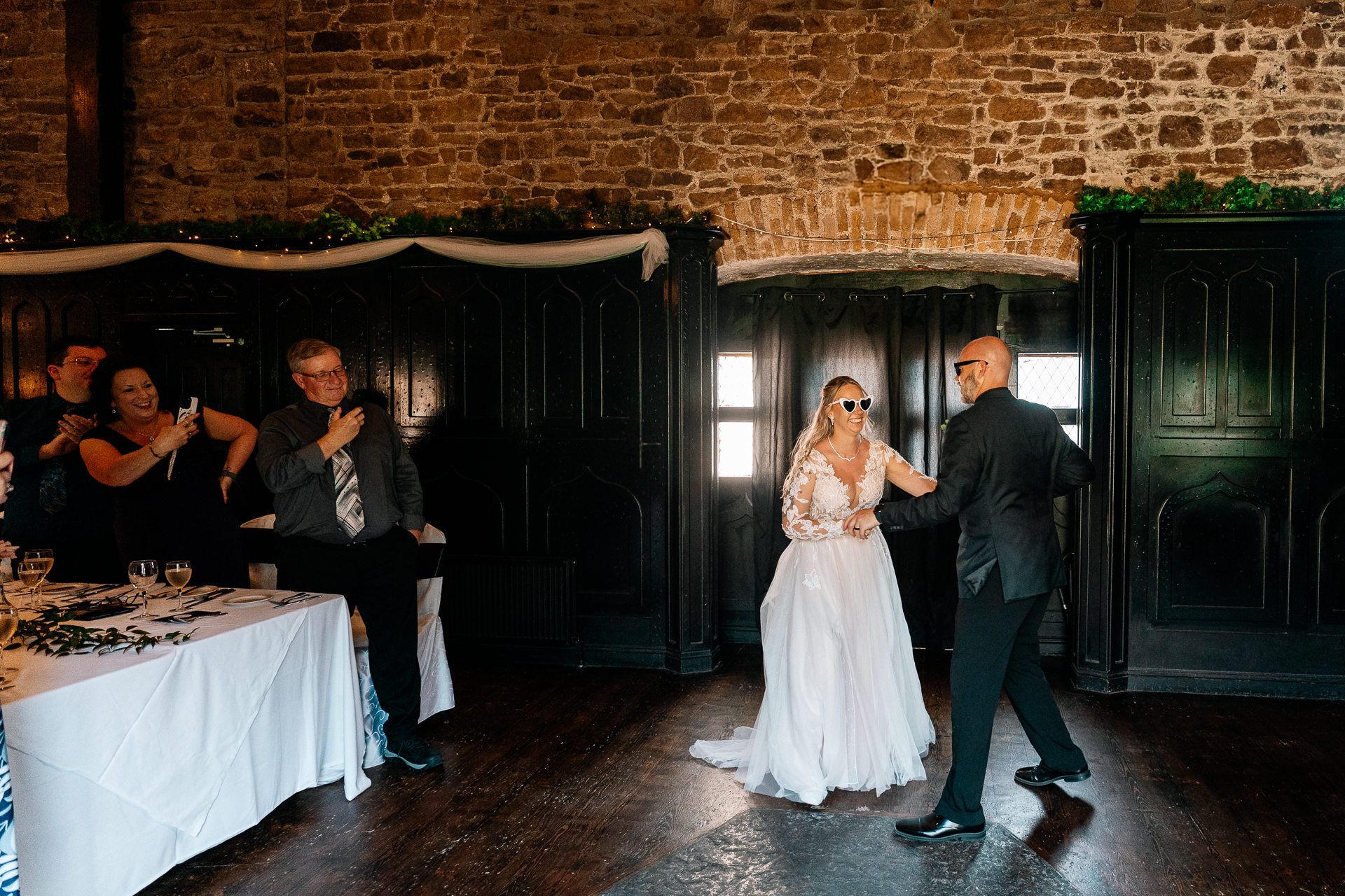 Bride and groom’s first dance and guests dancing in the cozy Dining Room at Kinnity Castle Hotel.