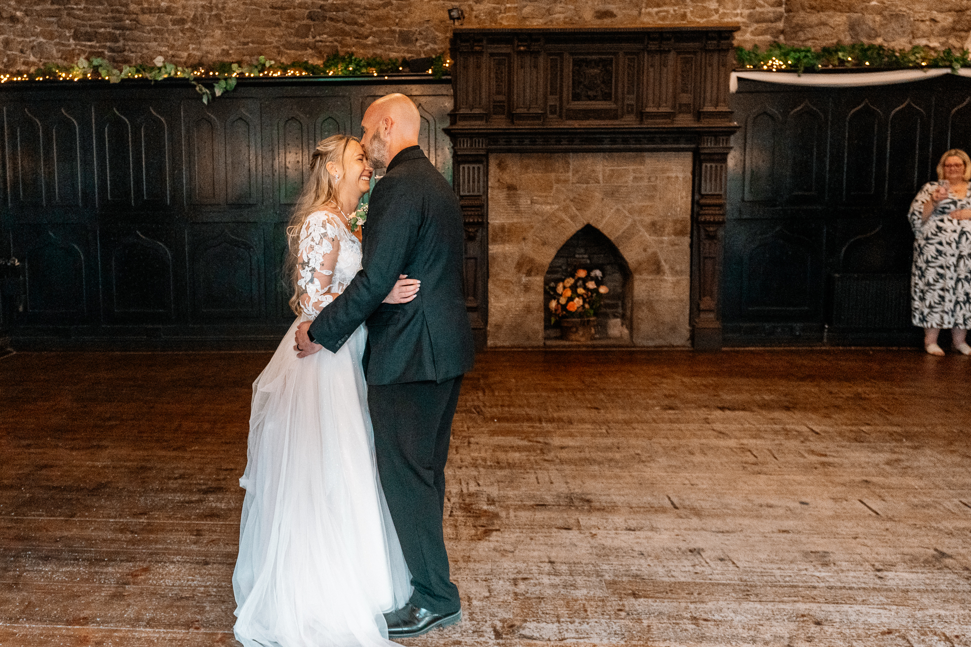Bride and groom’s first dance and guests dancing in the cozy Dining Room at Kinnity Castle Hotel.