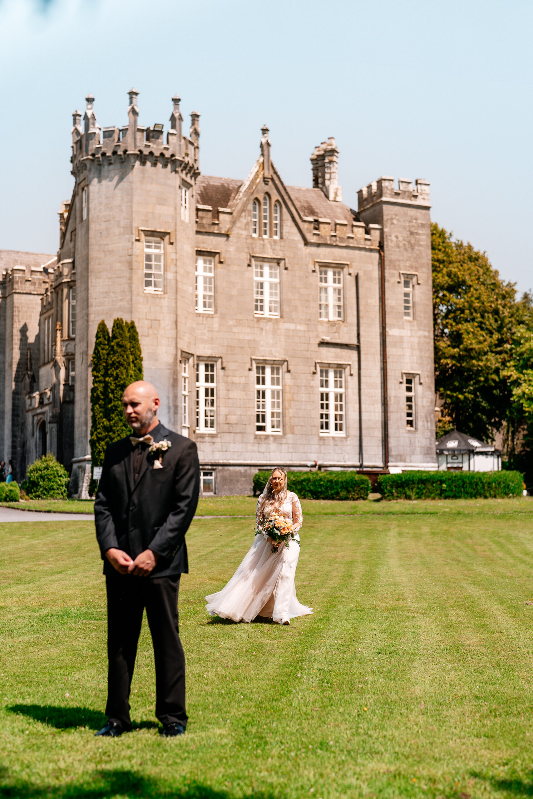 Bride and groom emotional First Look moment in front of Kinnity Castle Hotel.