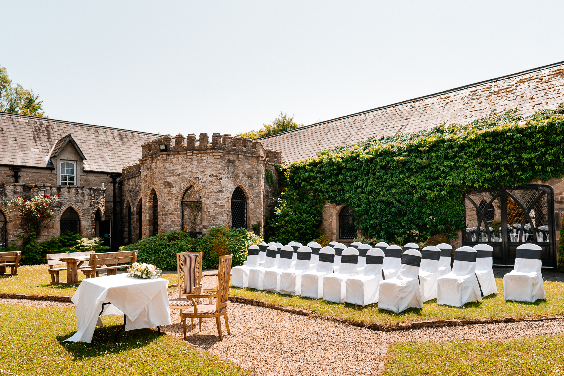 Outdoor wedding ceremony in the gardens of Kinnity Castle Hotel, Ireland.