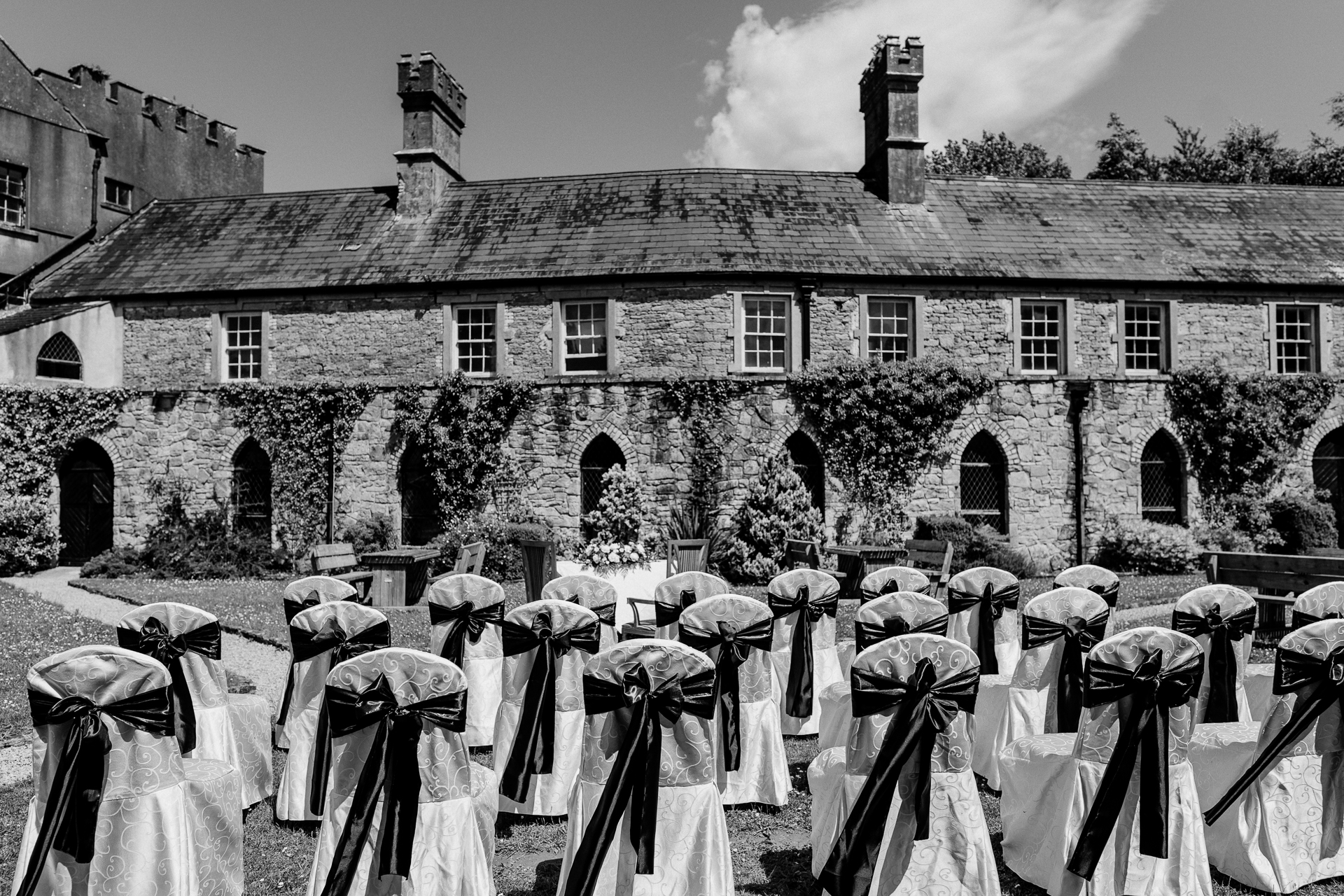 Outdoor wedding ceremony in the gardens of Kinnity Castle Hotel, Ireland.