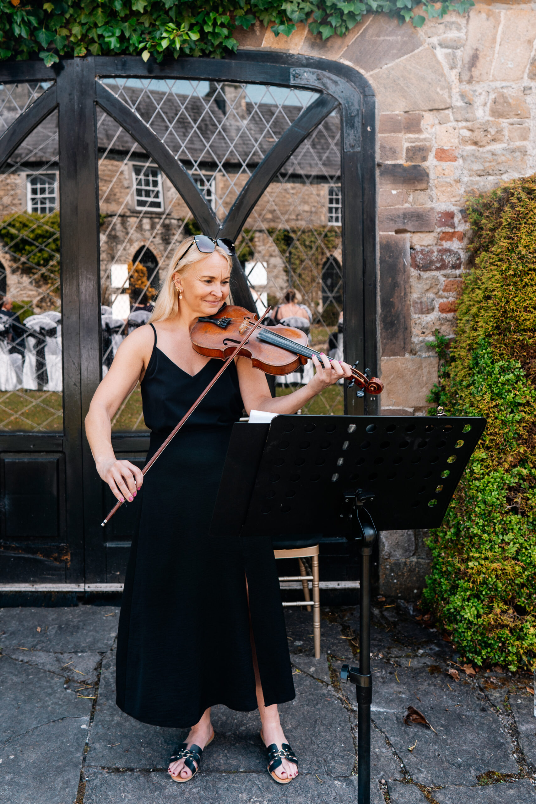 Outdoor wedding ceremony in the gardens of Kinnity Castle Hotel, Ireland.