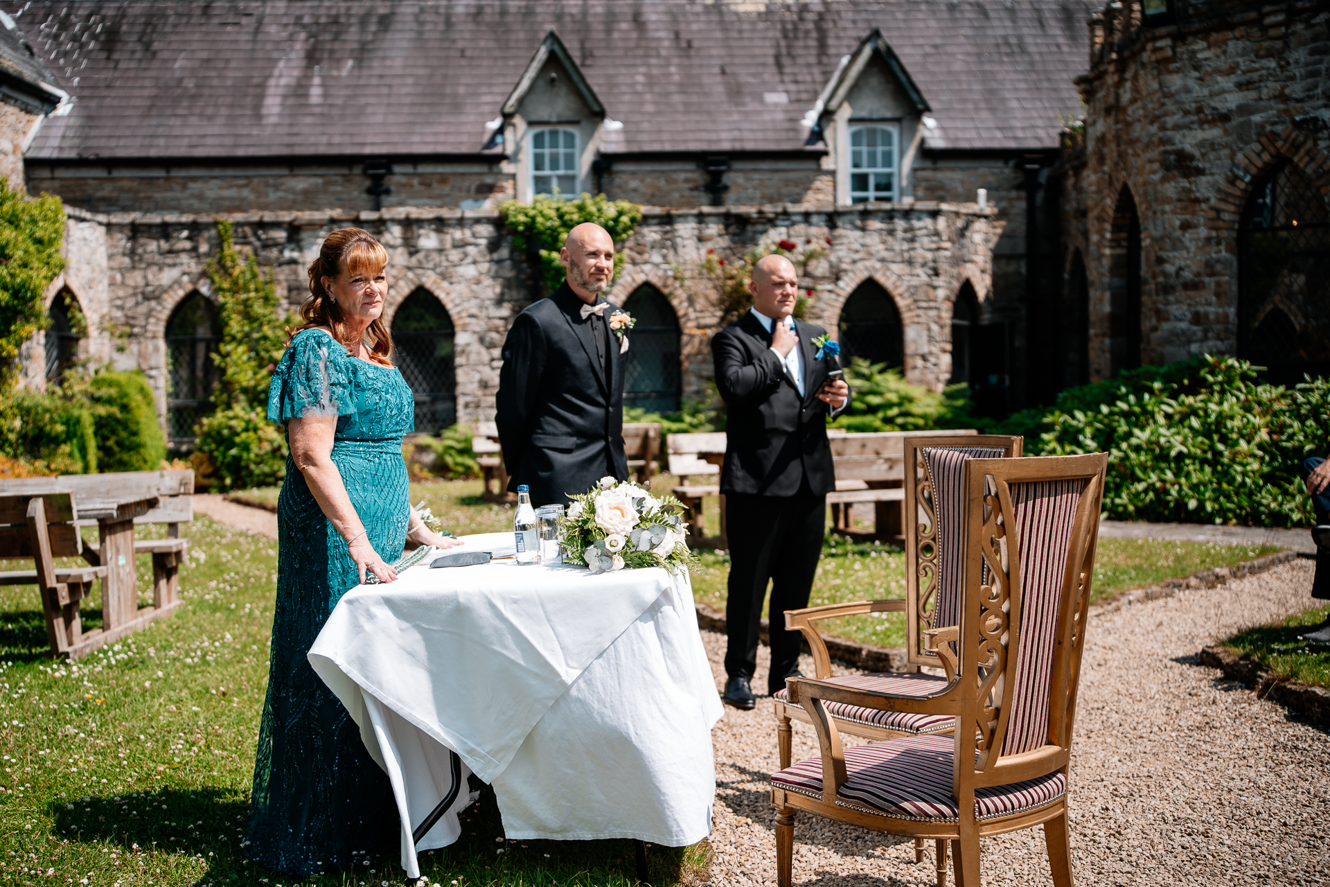 Outdoor wedding ceremony in the gardens of Kinnity Castle Hotel, Ireland.