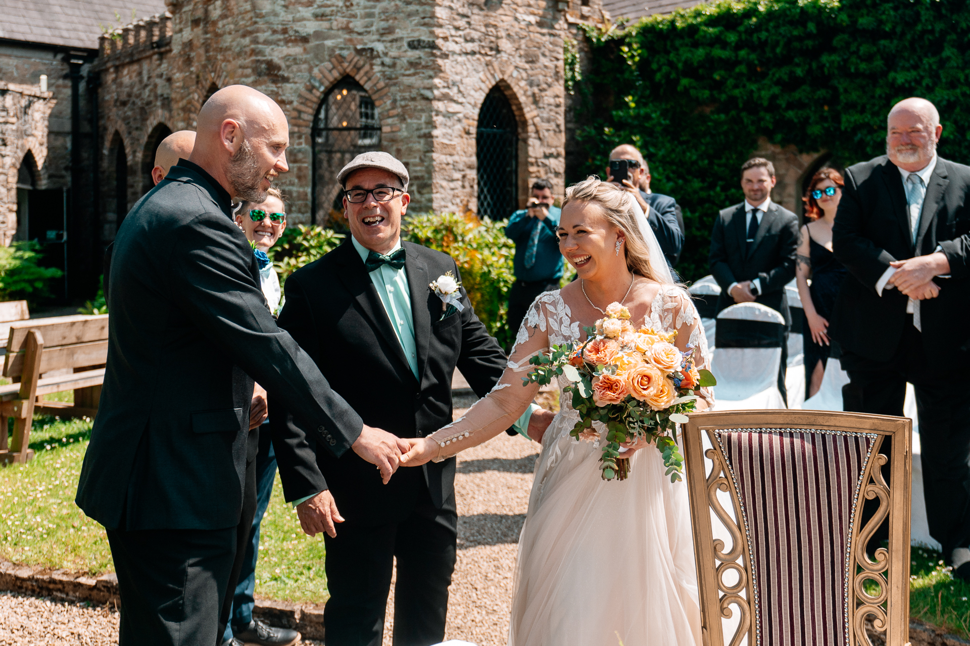 Outdoor wedding ceremony in the gardens of Kinnity Castle Hotel, Ireland.