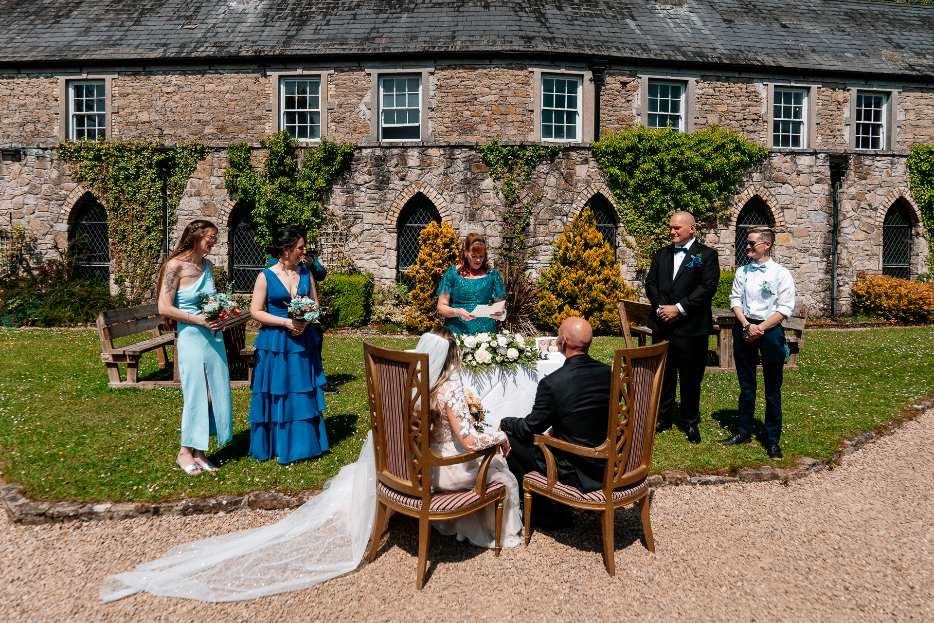 Outdoor wedding ceremony in the gardens of Kinnity Castle Hotel, Ireland.