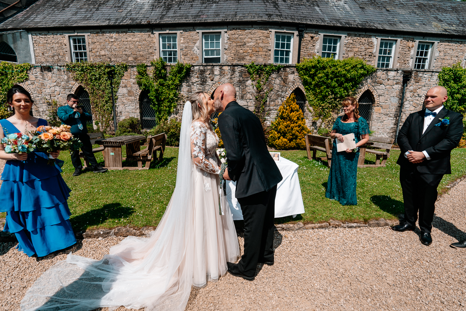 Outdoor wedding ceremony in the gardens of Kinnity Castle Hotel, Ireland.