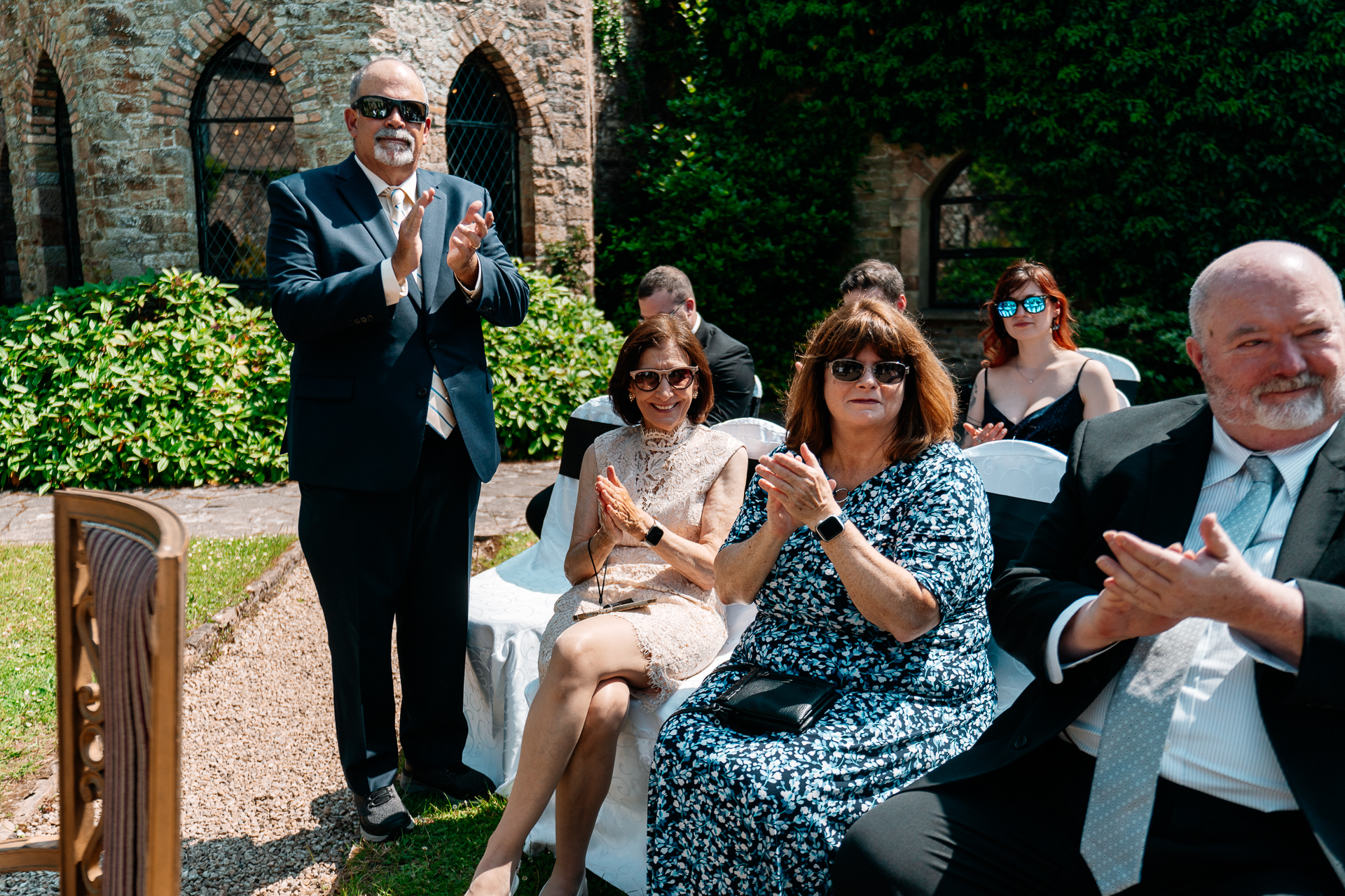 Outdoor wedding ceremony in the gardens of Kinnity Castle Hotel, Ireland.