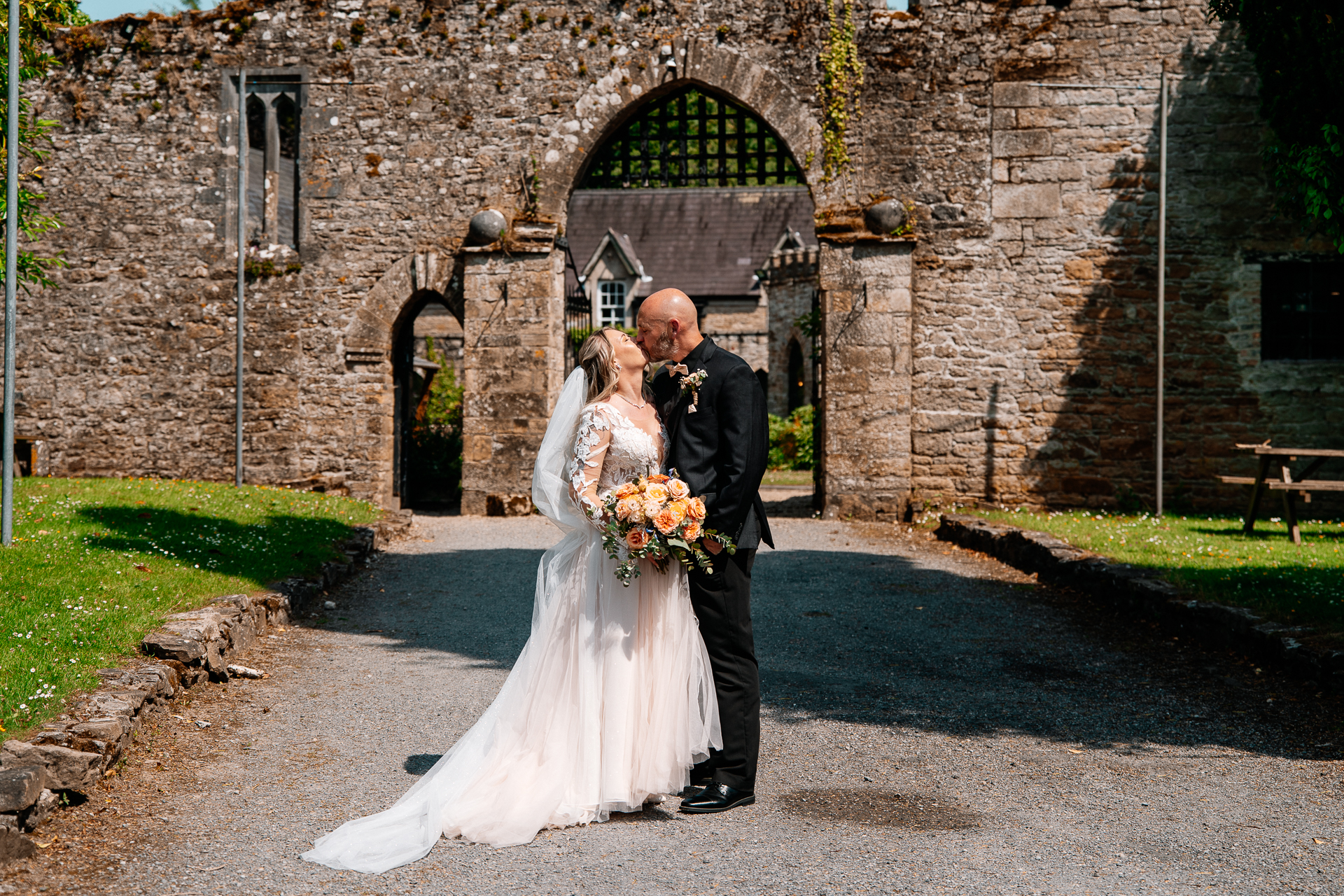 Outdoor wedding ceremony in the gardens of Kinnity Castle Hotel, Ireland.