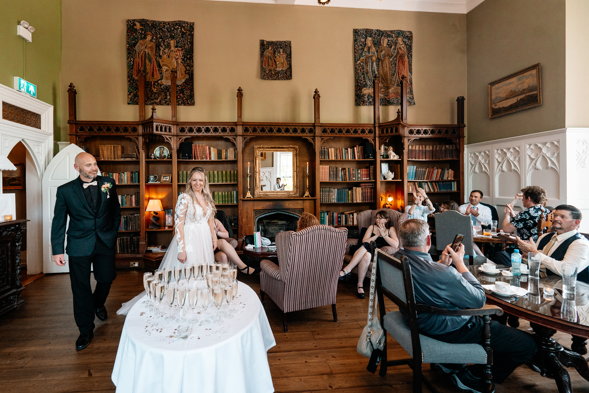 Wedding reception in the cozy Library Bar at Kinnity Castle Hotel, surrounded by books and candlelight.