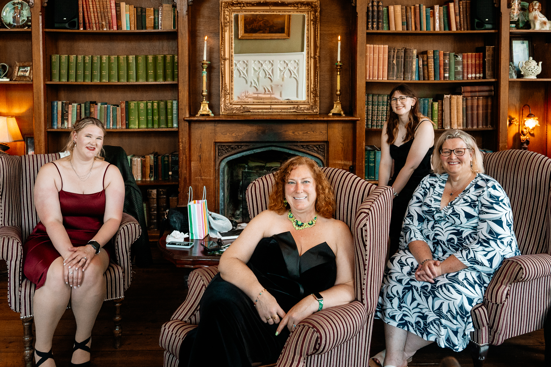 Wedding reception in the cozy Library Bar at Kinnity Castle Hotel, surrounded by books and candlelight.