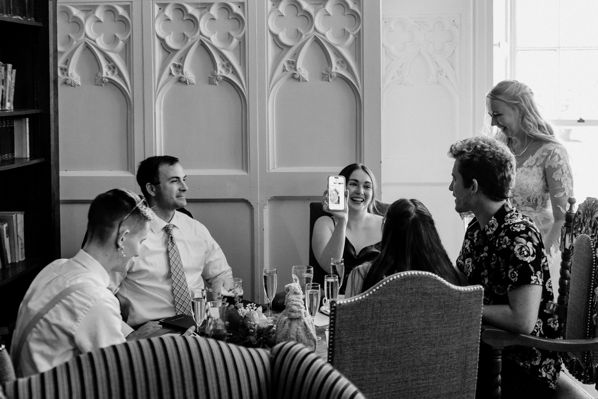 Wedding reception in the cozy Library Bar at Kinnity Castle Hotel, surrounded by books and candlelight.
