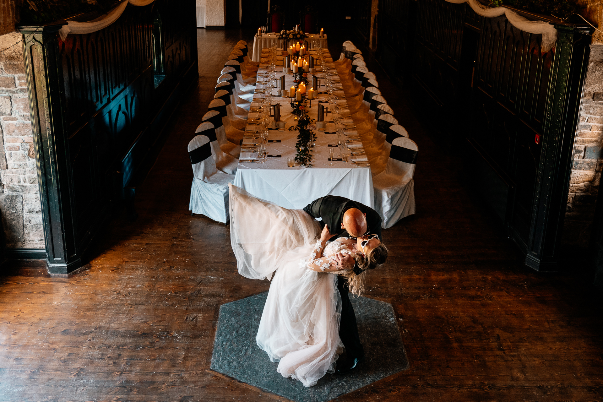 Cozy dining room and library bar setup at Kinnity Castle Hotel with bookshelves, open fire, rustic florals, and elegant details.