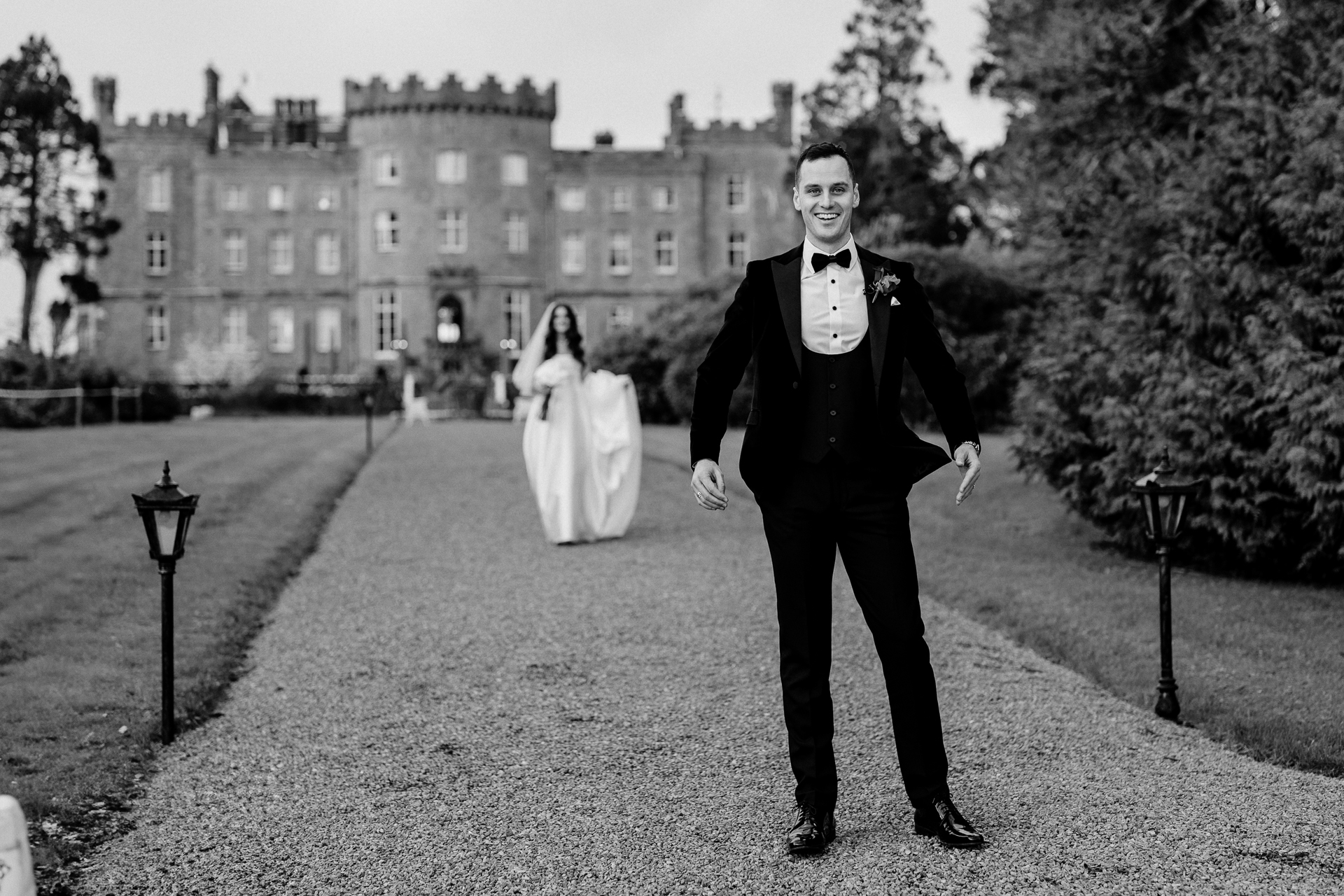 First look moment at Markree Castle – bride walking toward the groom with castle in the background

