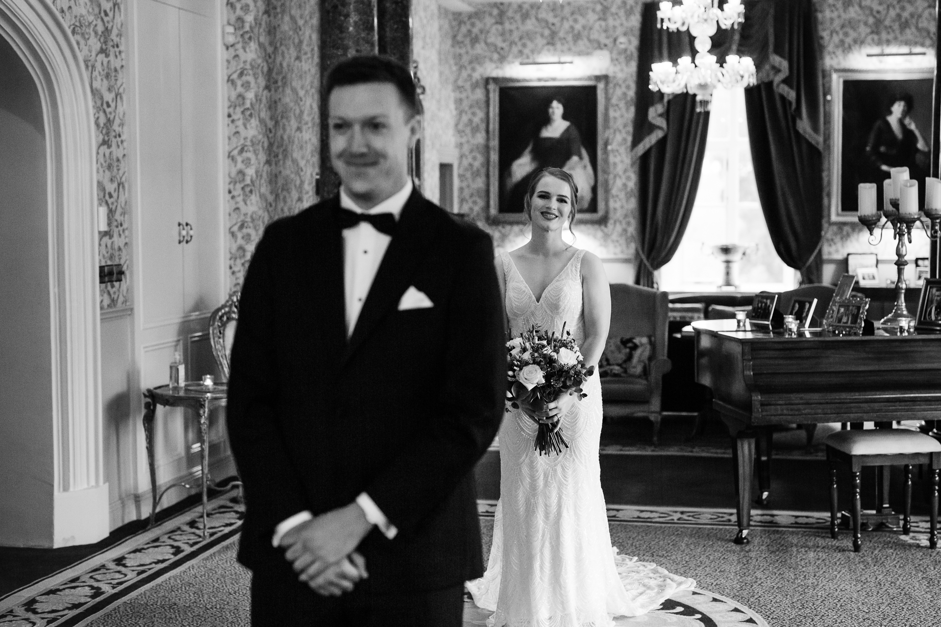Bride walks towards groom during their emotional first look inside Markree Castle’s Billiard Room

