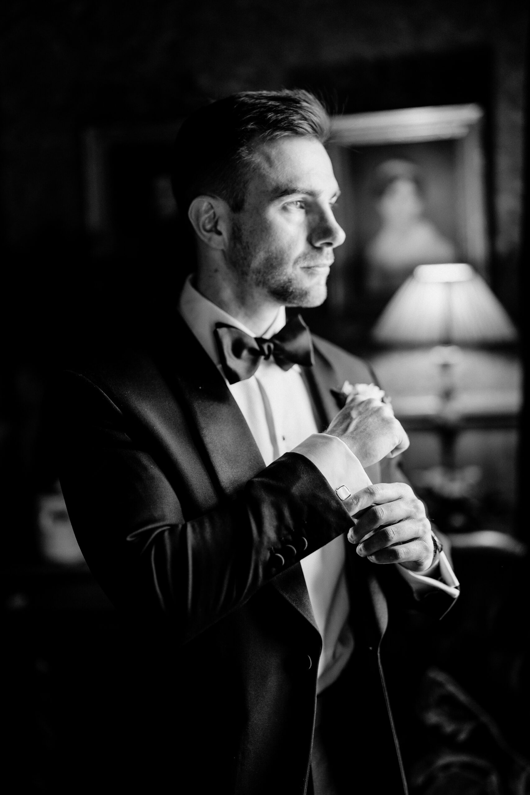 Groom getting ready for his wedding at Markree Castle – a black and white portrait in natural light

