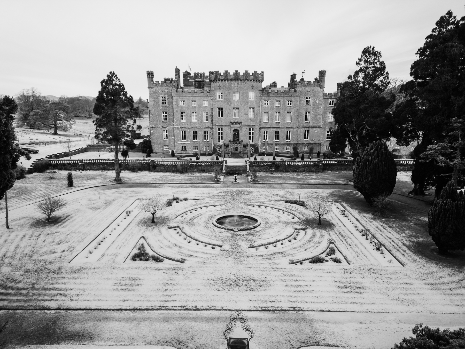 Black and white winter view of Markree Castle and garden from above – wedding venue in snow

