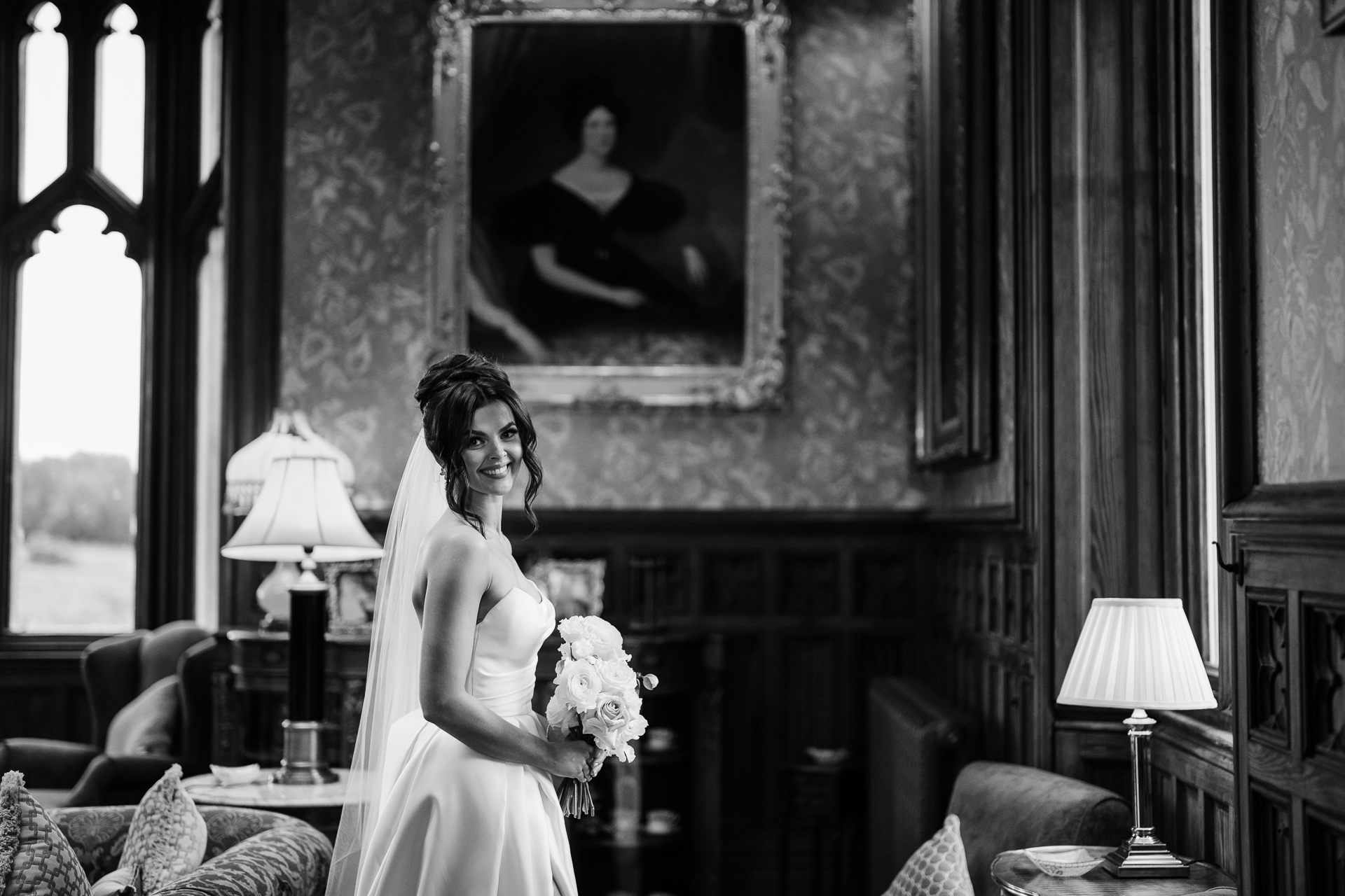 Bride standing in the drawing room at Markree Castle – black and white wedding portrait in elegant Irish castle

