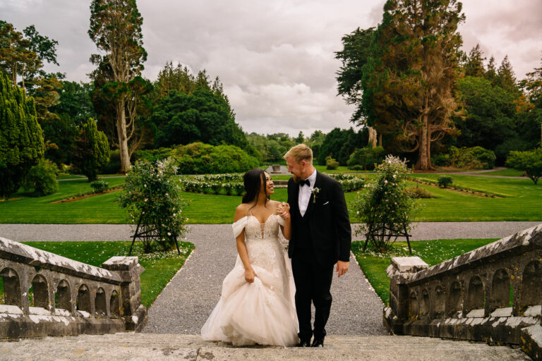 Bride and groom walking down garden steps at Markree Castle Wedding in Ireland