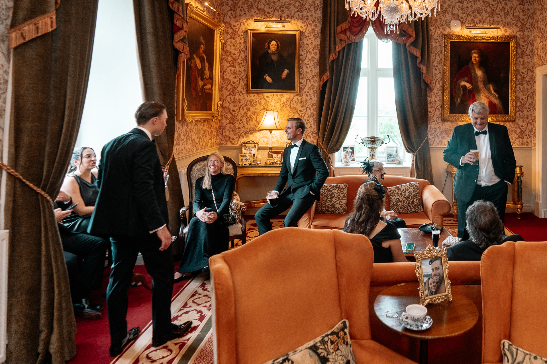 Guests enjoying the wedding reception and speeches at Markree Castle, with Irish Wolfhound Fionn joining the celebration