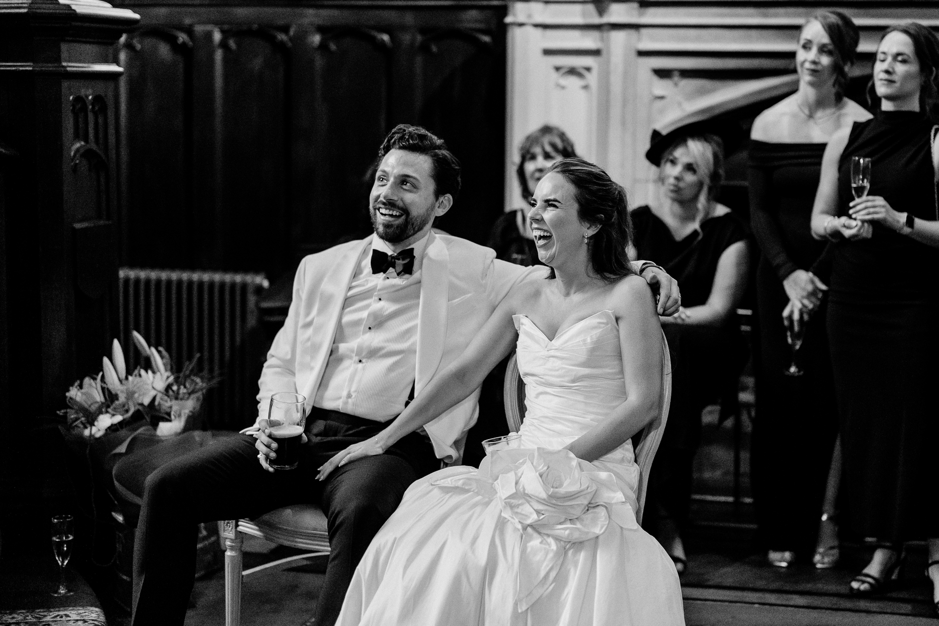 Guests enjoying the wedding reception and speeches at Markree Castle, with Irish Wolfhound Fionn joining the celebration