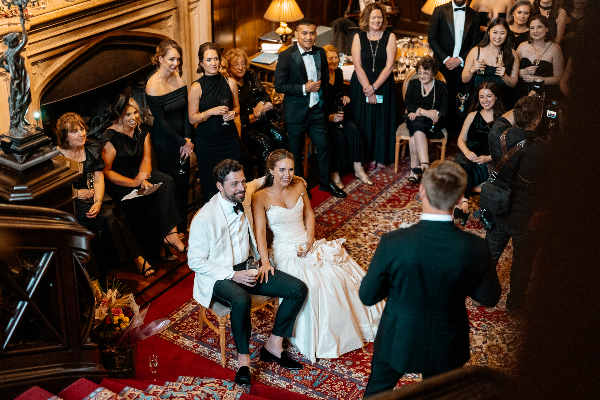 Guests enjoying the wedding reception and speeches at Markree Castle, with Irish Wolfhound Fionn joining the celebration