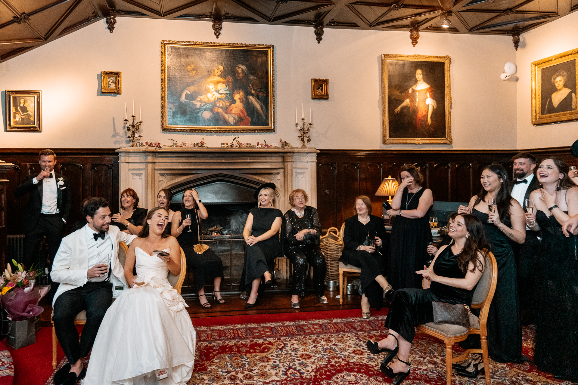 Guests enjoying the wedding reception and speeches at Markree Castle, with Irish Wolfhound Fionn joining the celebration