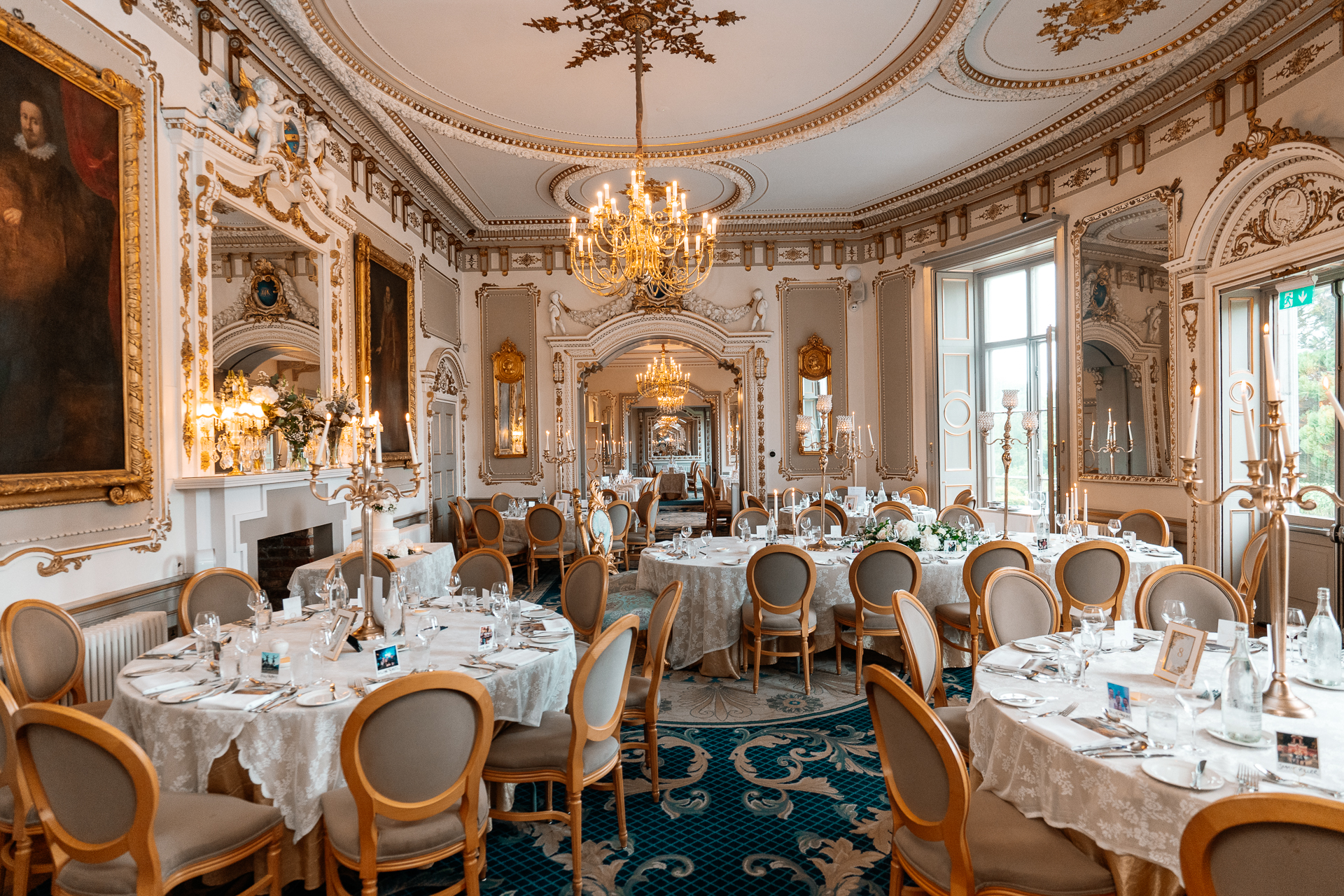 Candid wedding dinner, cake cutting, and live music at Markree Castle dining room