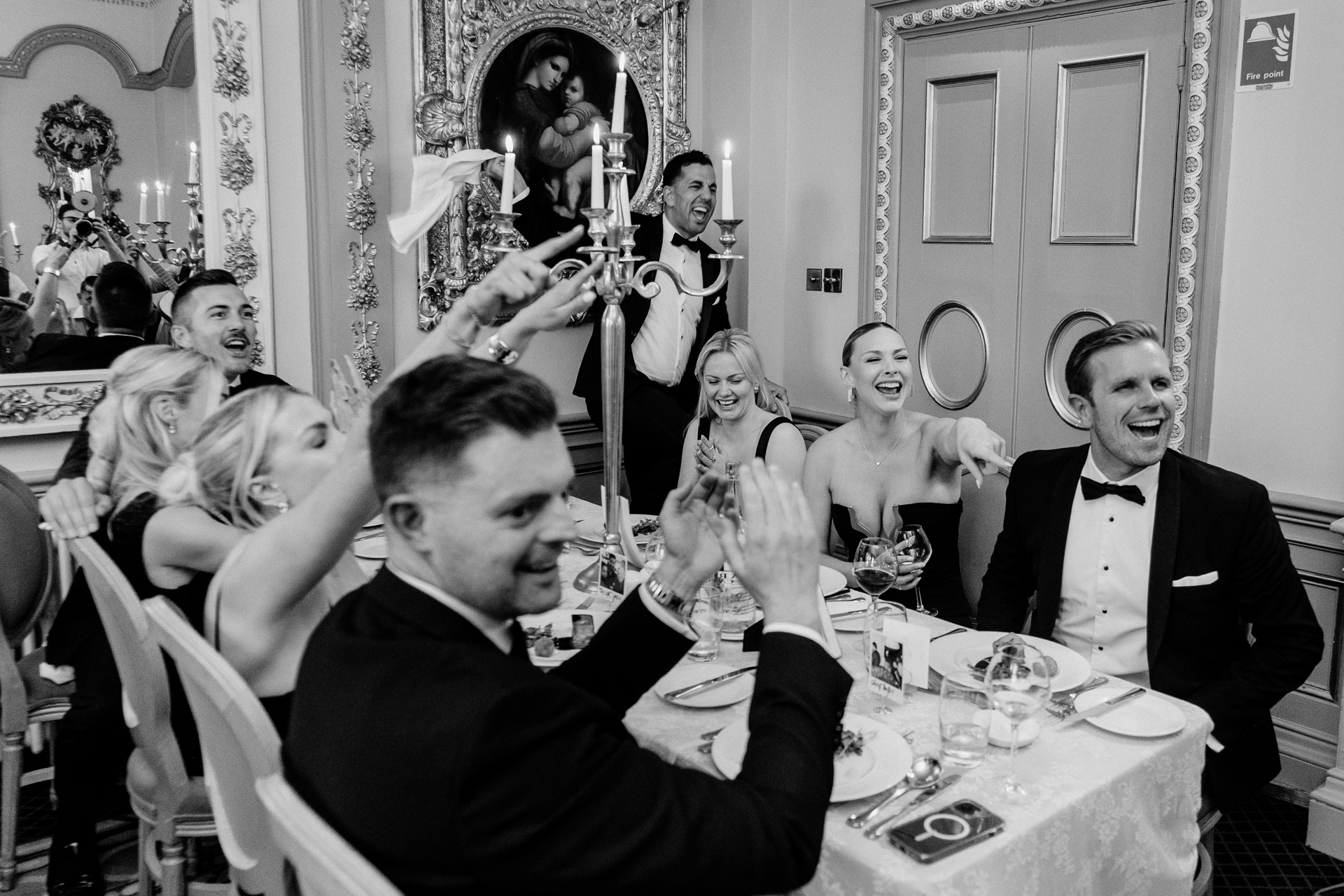 Candid wedding dinner, cake cutting, and live music at Markree Castle dining room