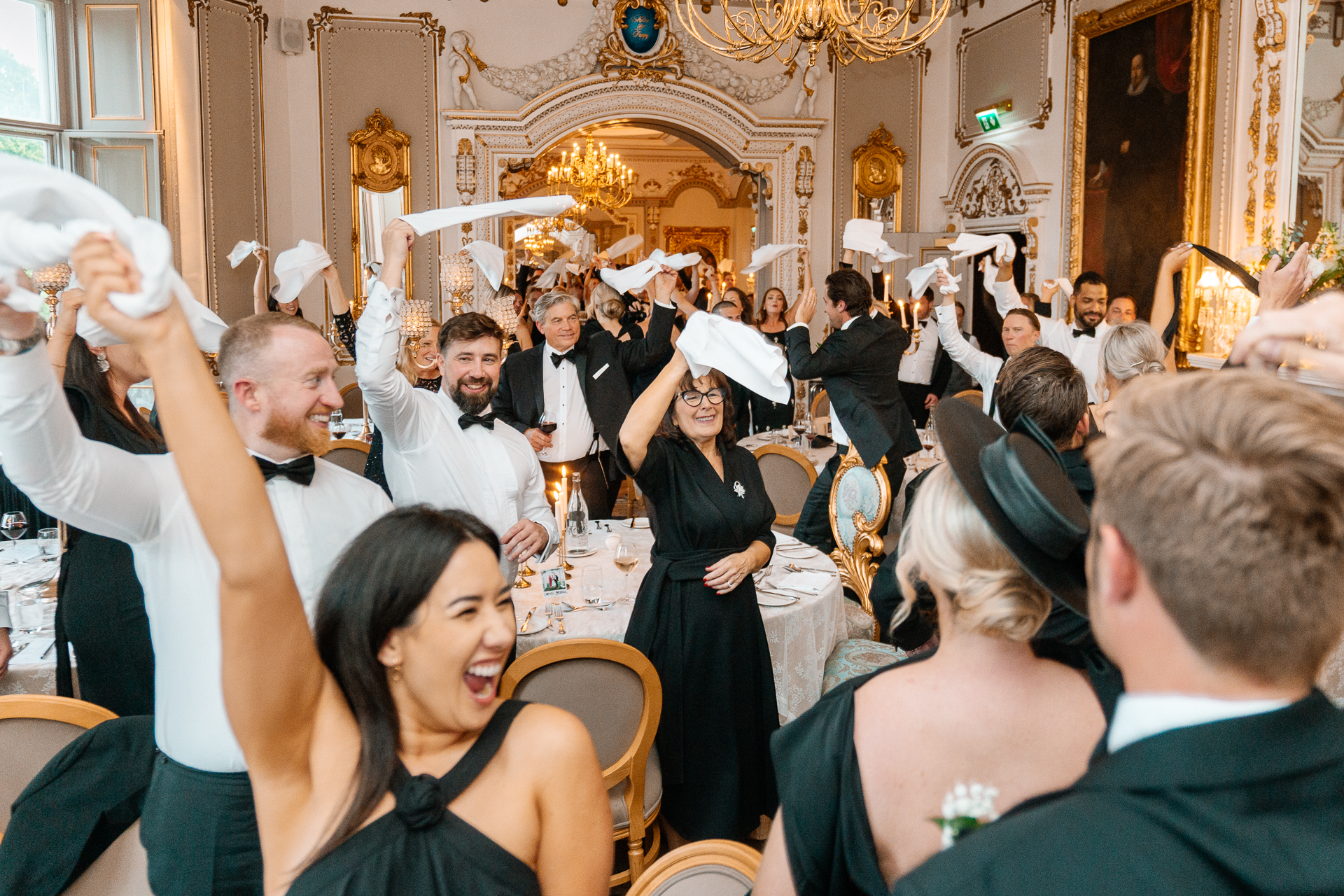 Candid wedding dinner, cake cutting, and live music at Markree Castle dining room