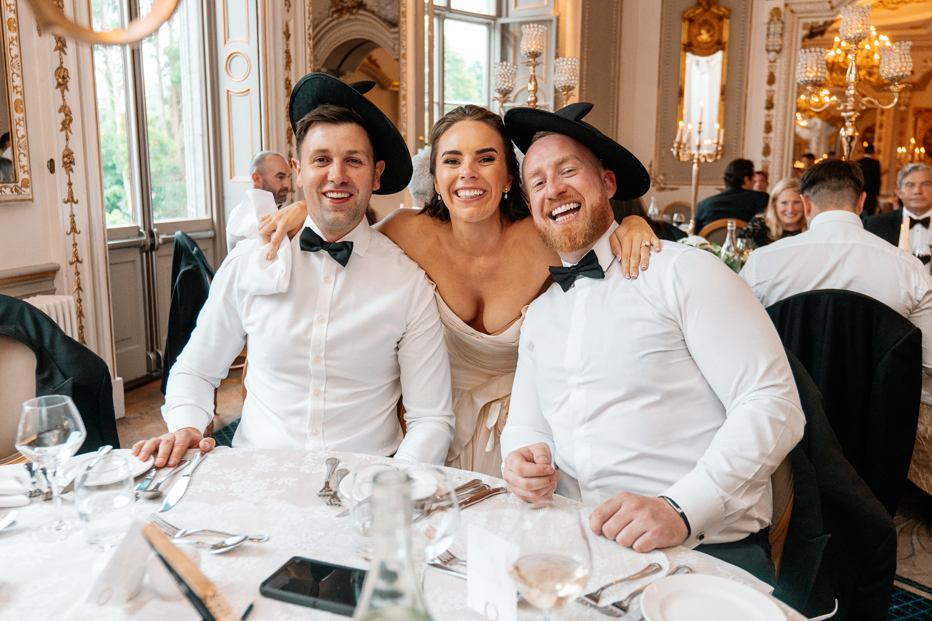 Candid wedding dinner, cake cutting, and live music at Markree Castle dining room
