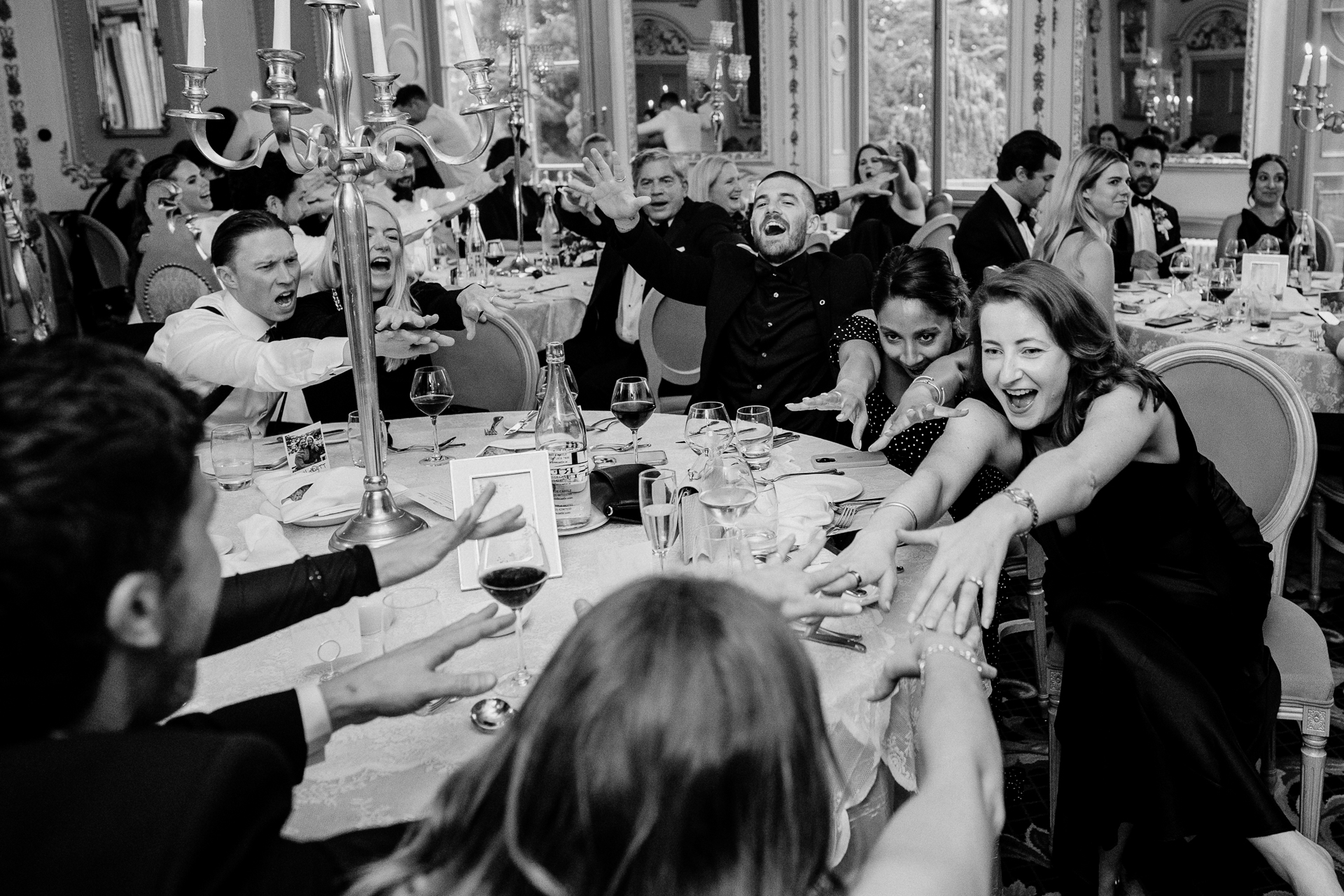 Candid wedding dinner, cake cutting, and live music at Markree Castle dining room
