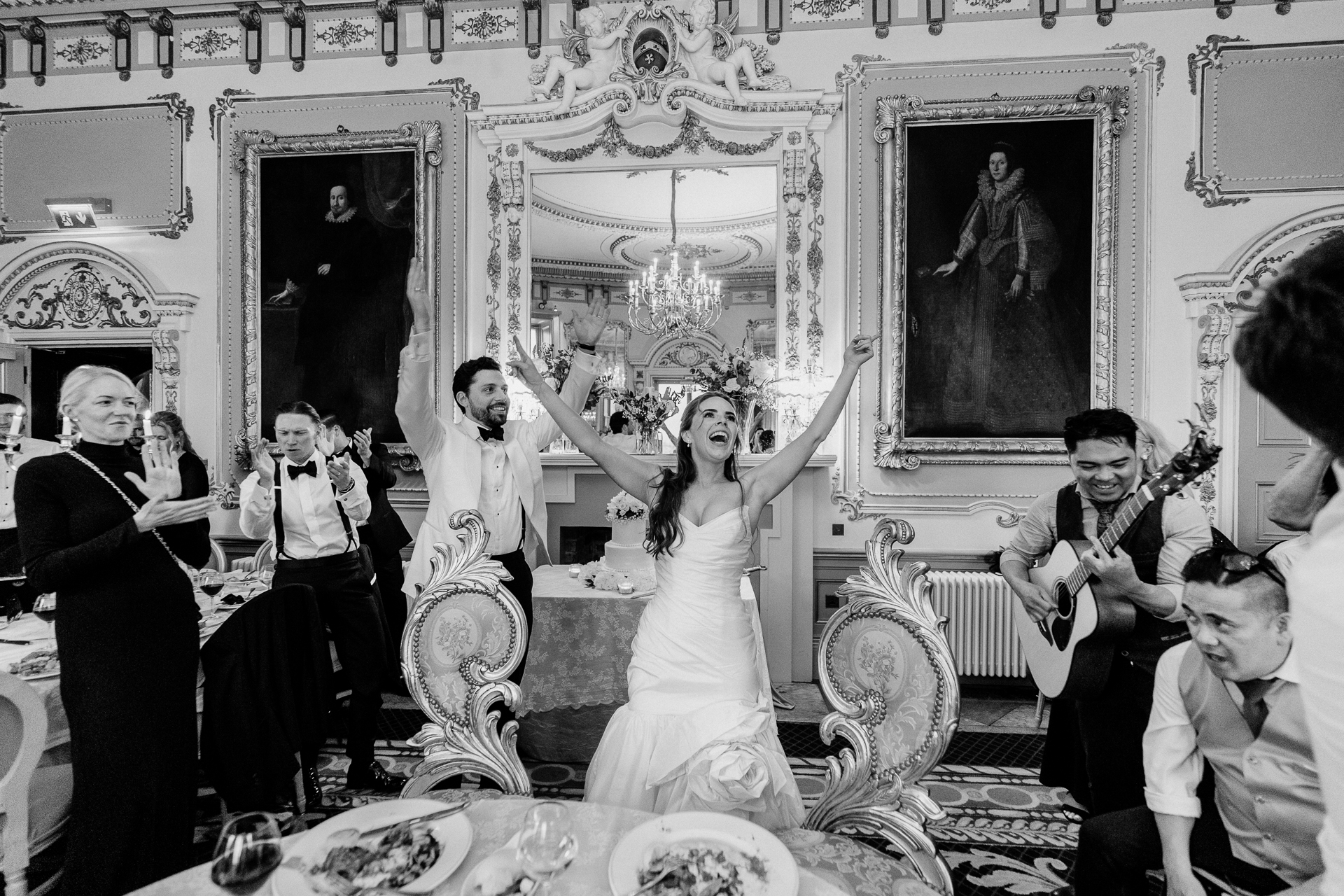 Candid wedding dinner, cake cutting, and live music at Markree Castle dining room