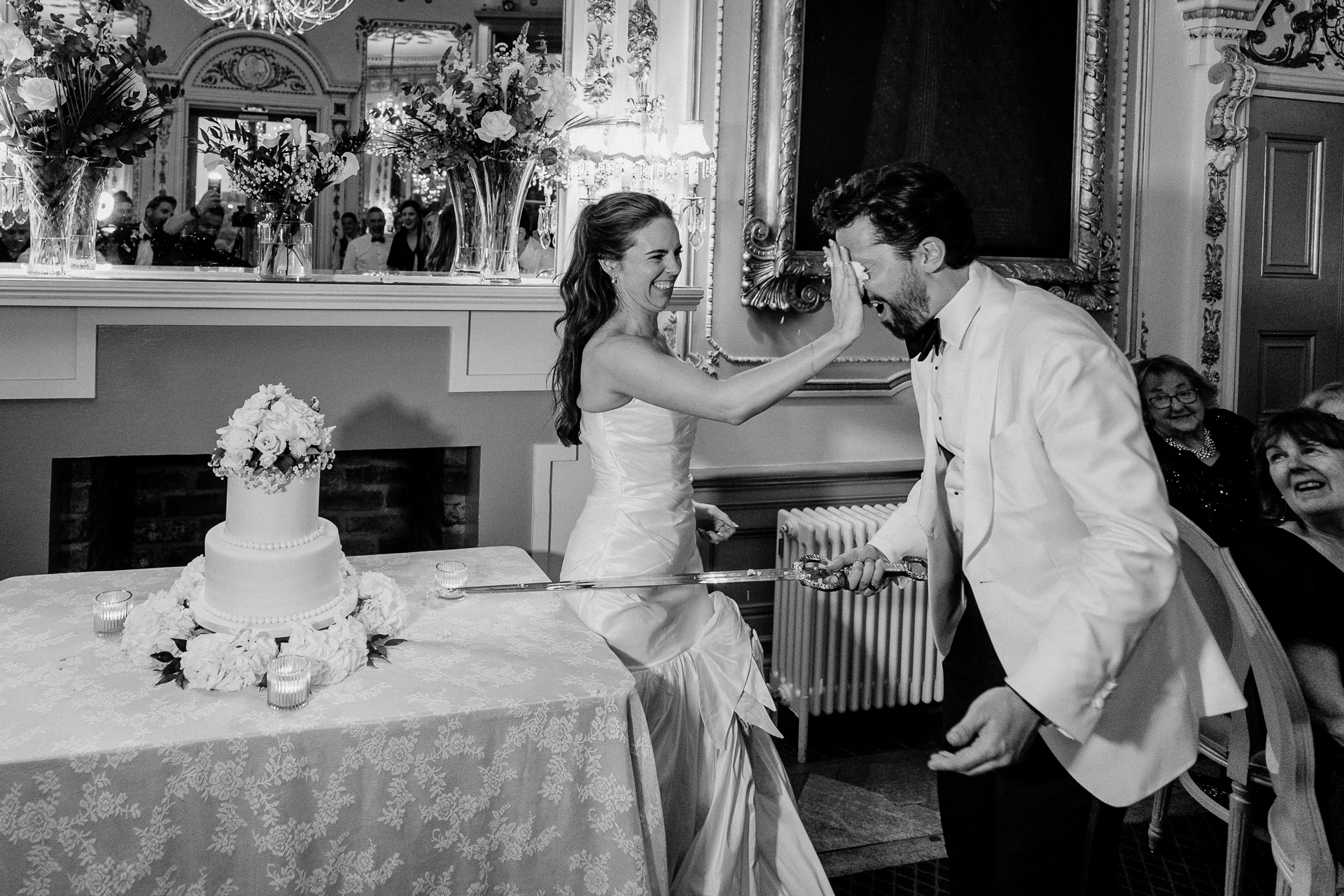 Bride and groom cutting the wedding cake during the reception at Markree Castle

