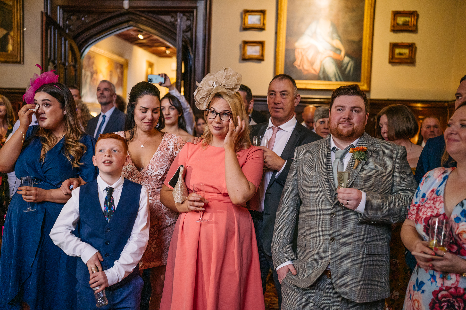 Emotional wedding guests laughing and reacting during speeches at Markree Castle

