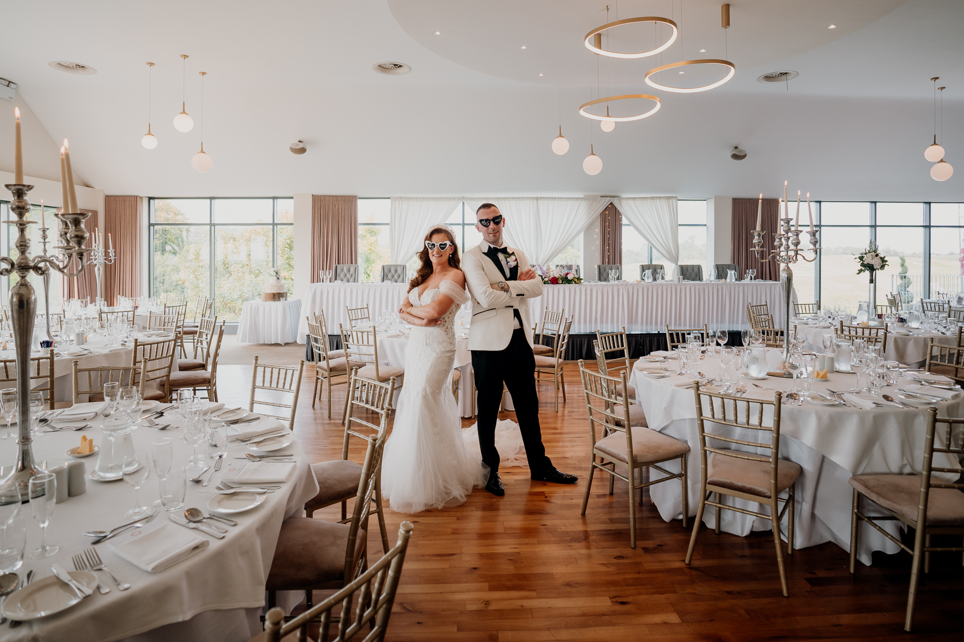 Castle Dargan wedding reception dining room with panoramic views Bride and groom portraits inside Castle Dargan Estate dining room Elegant Castle Dargan wedding dining room setup in Sligo