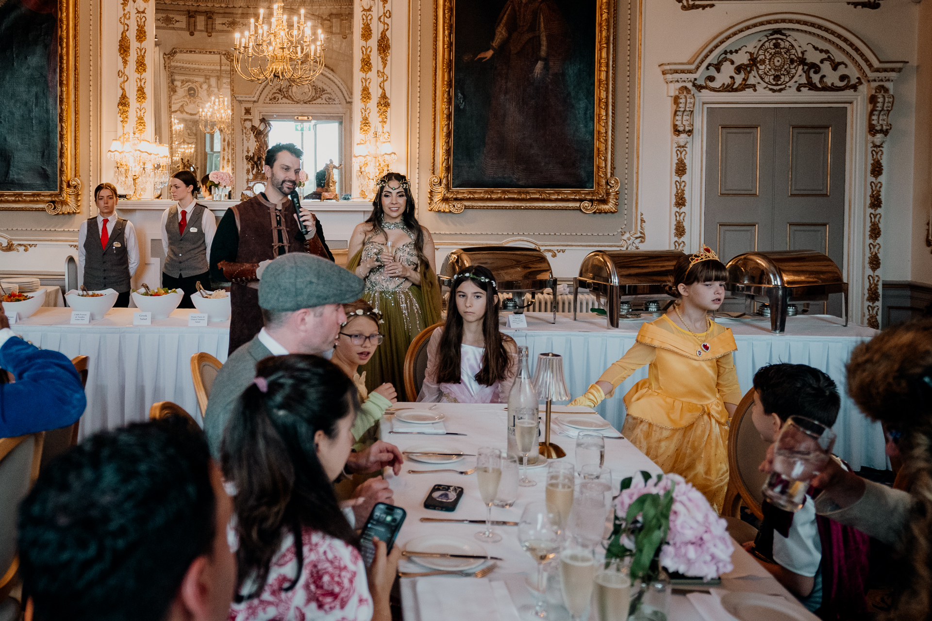 Guests arriving for fantasy-themed rehearsal dinner in the grand dining room of Markree Castle, Sligo, Ireland