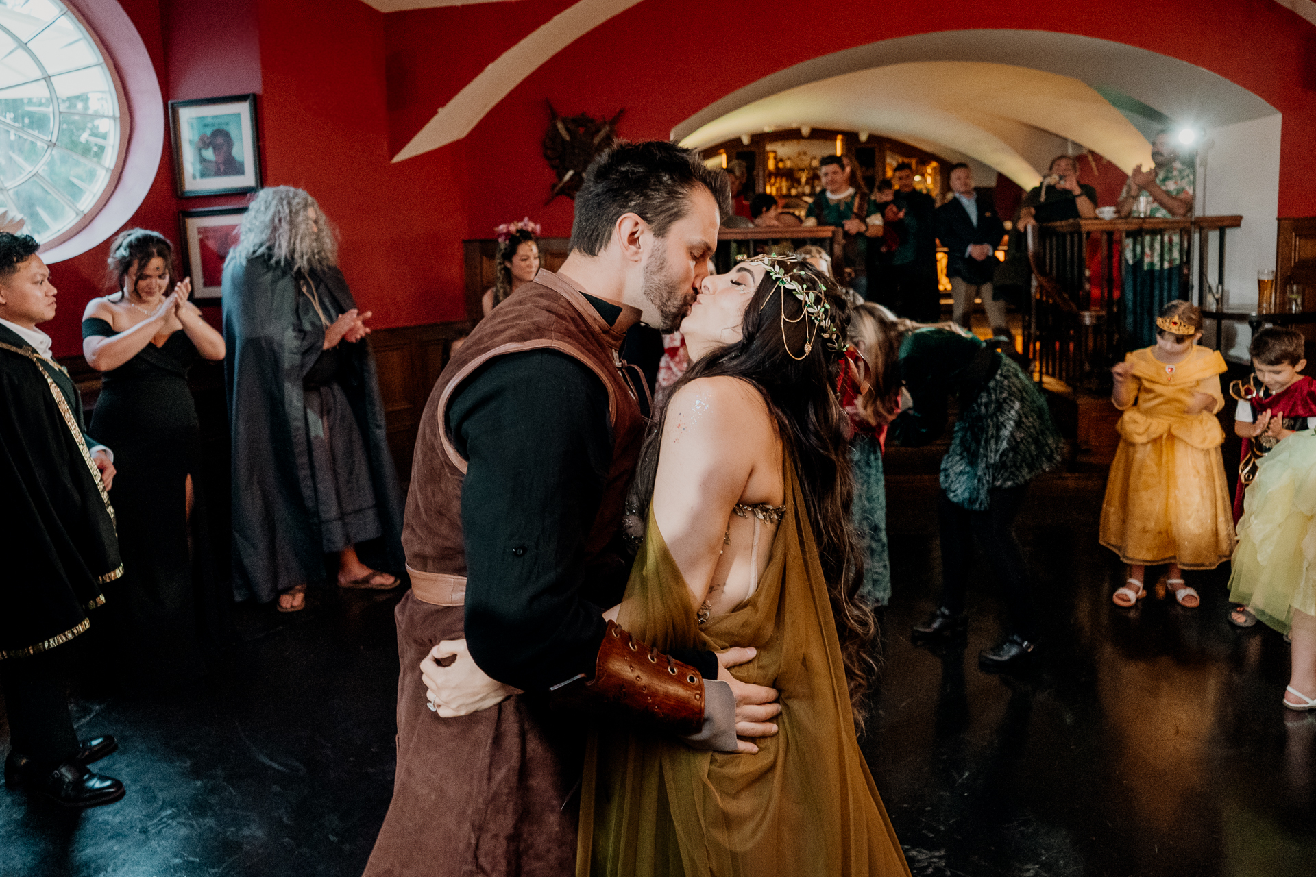 Guests mingling in fantasy-inspired costumes during a rehearsal dinner at Markree Castle in Sligo, Ireland