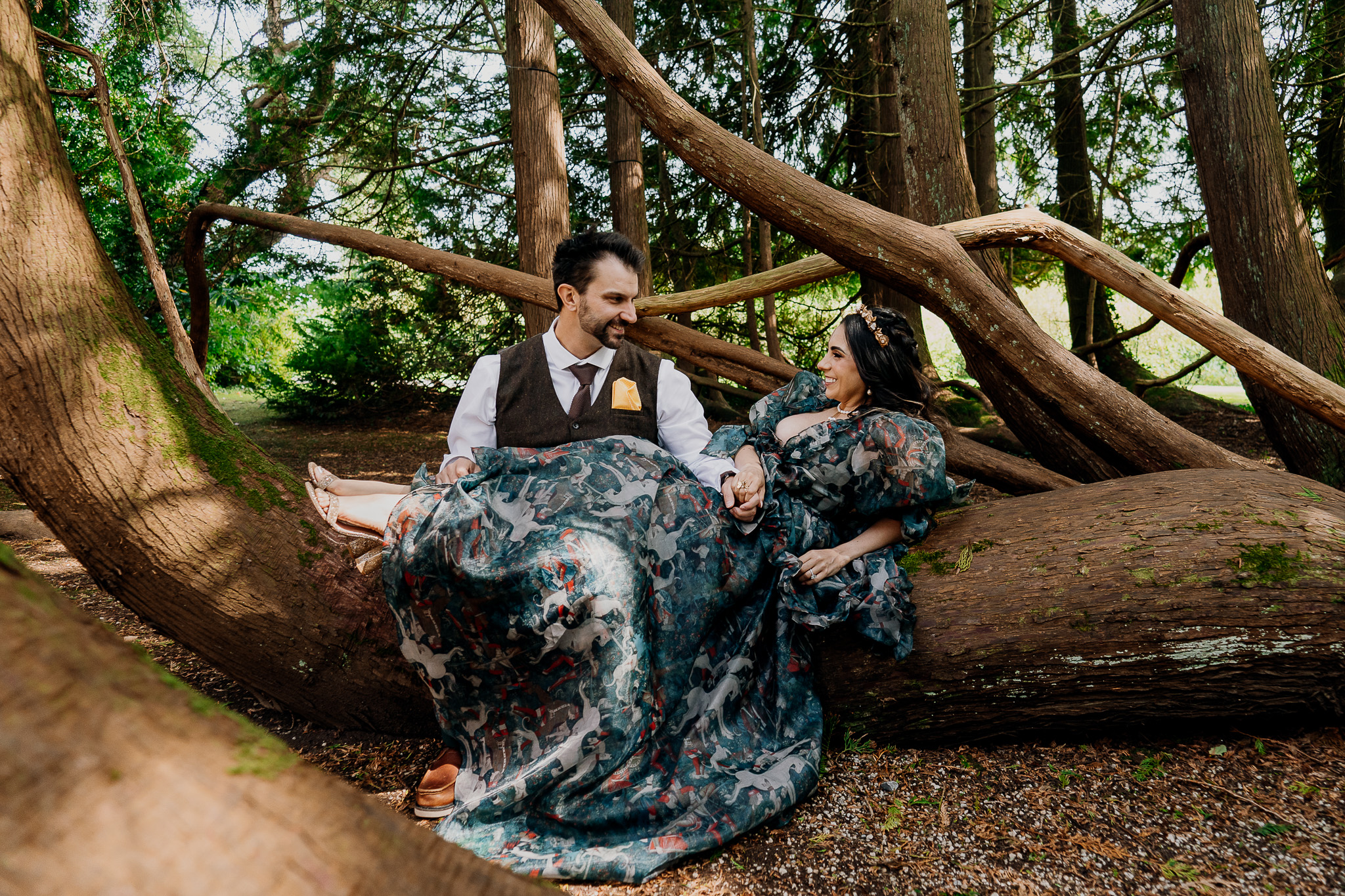 Couple sitting beneath a large tree during their pre-wedding session at Markree Castle