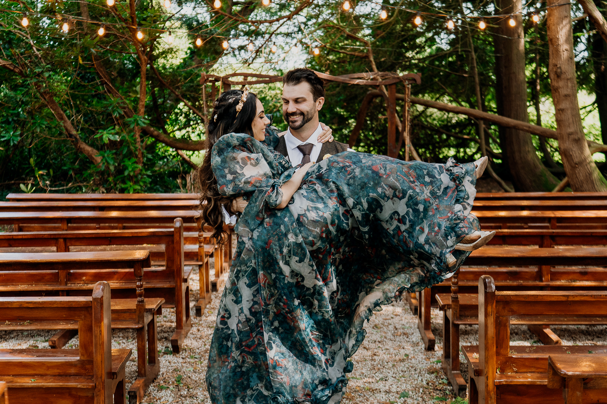 Couple posing by a wooden bench during their pre-wedding session at Markree Castle