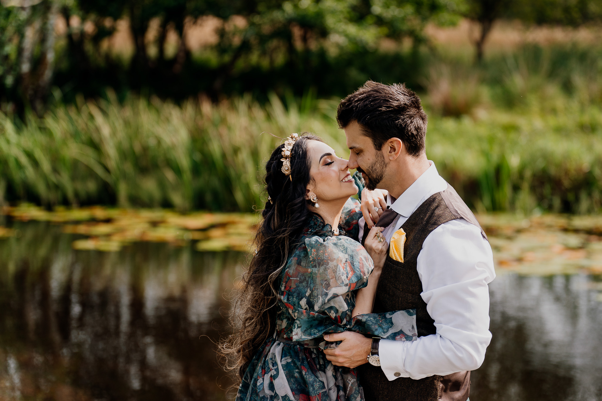 Couple embracing beside the water during their pre-wedding session at Markree Castle