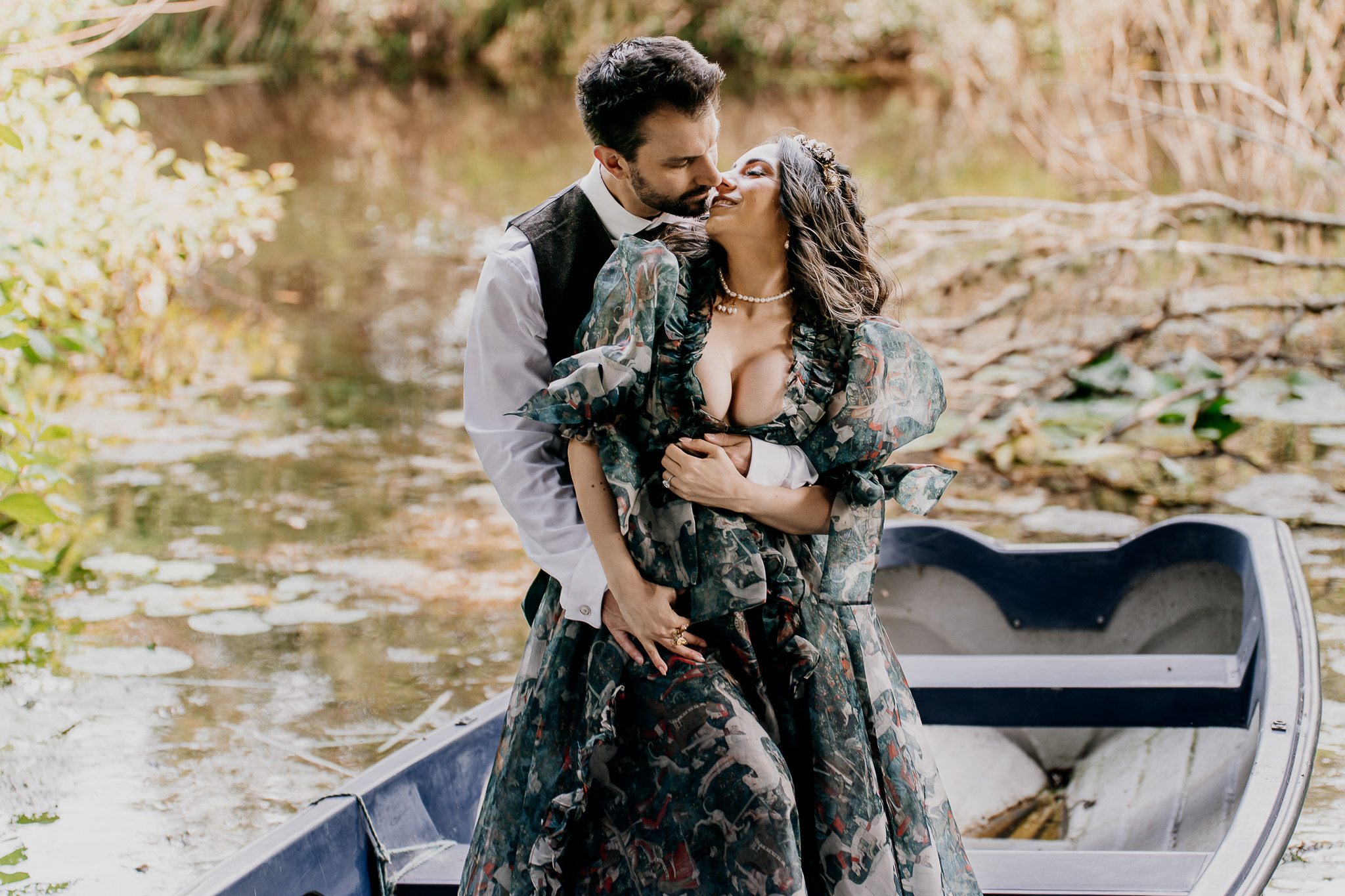 Couple sitting in a boat at the Markree Castle Boathouse during their pre-wedding session