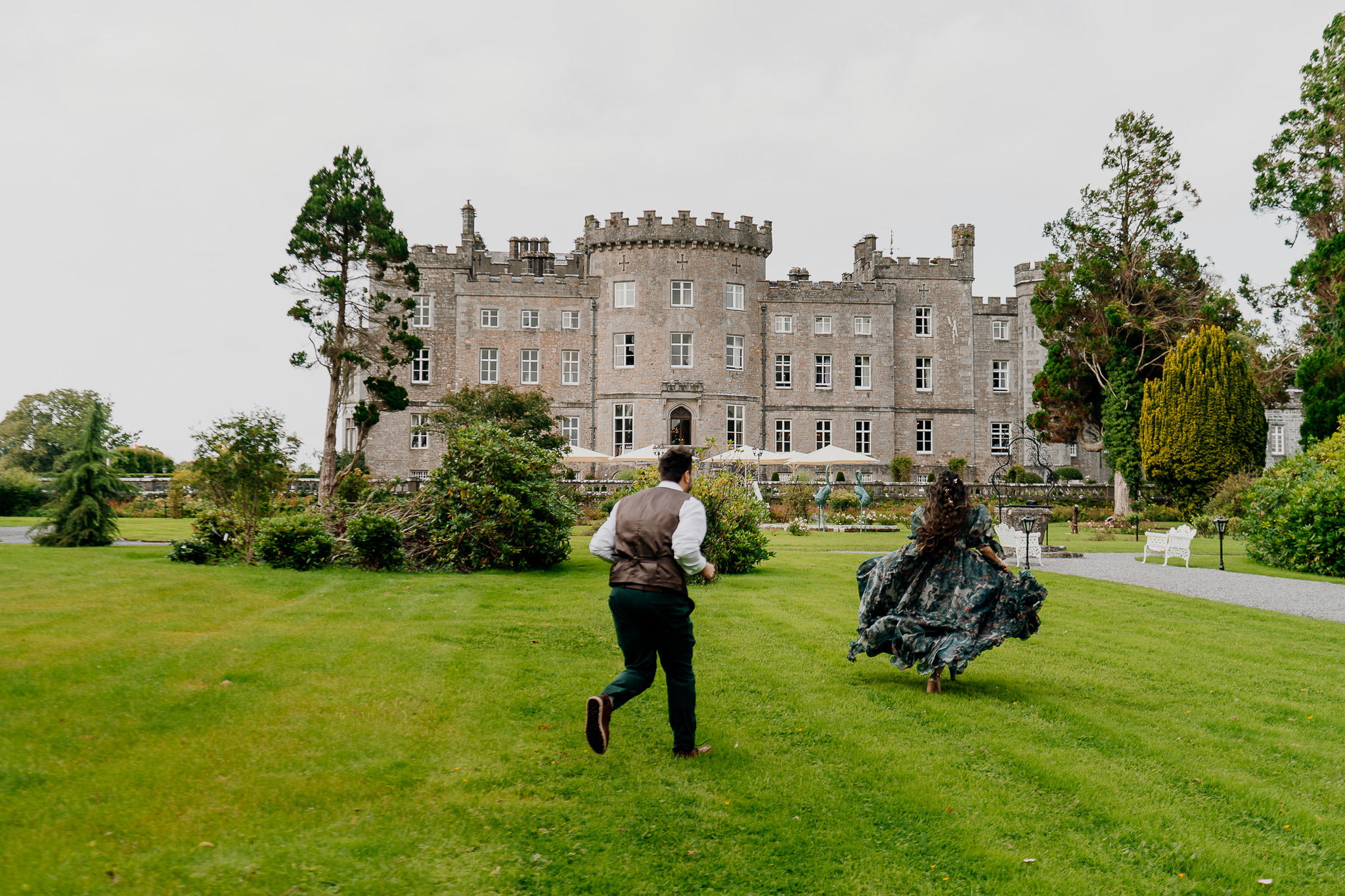 Couple walking in front of Markree Castle during their pre-wedding photo session