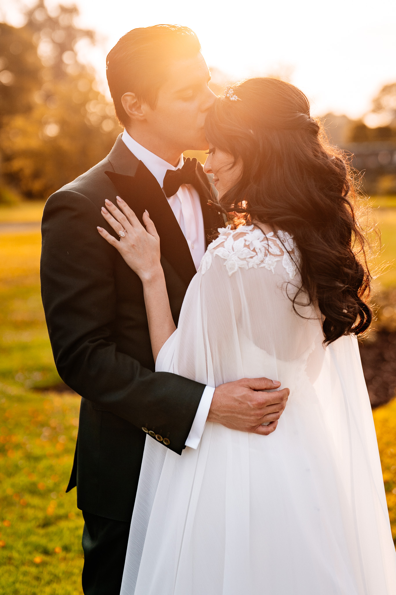 Bride and groom sharing a romantic sunset wedding portrait at Markree Castle