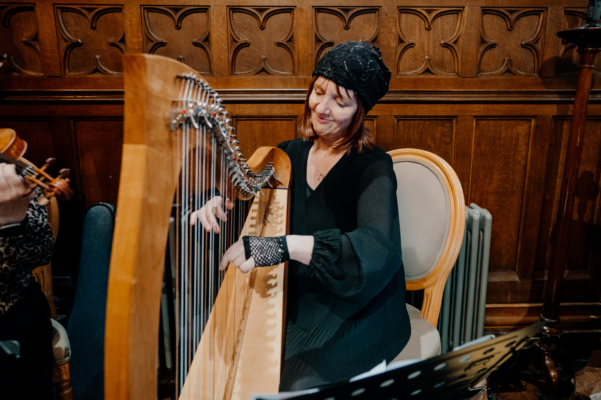 Harpist playing during a wedding ceremony in the chapel at Markree Castle