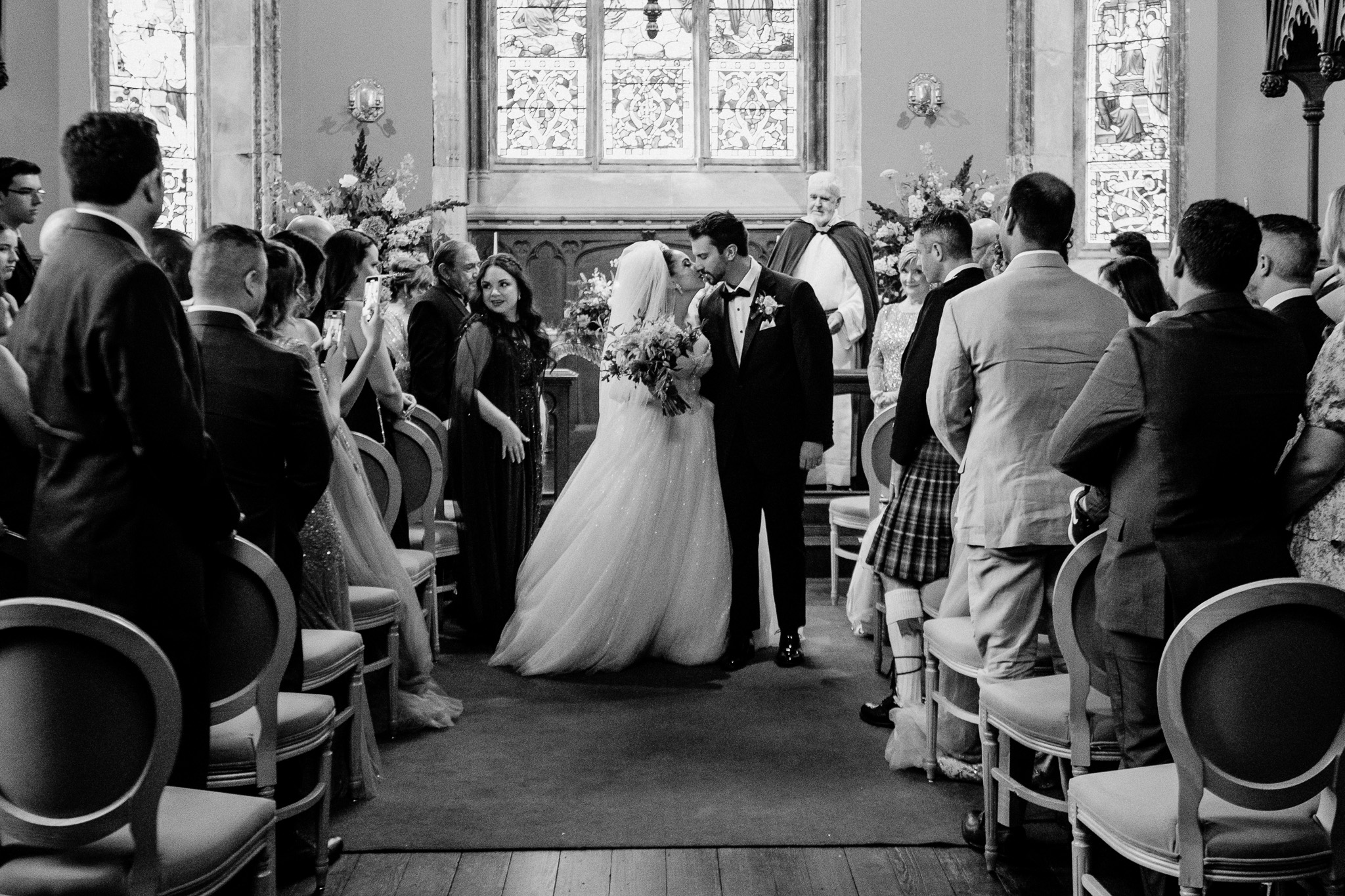 Wedding guests gathered for a ceremony inside the chapel at Markree Castle